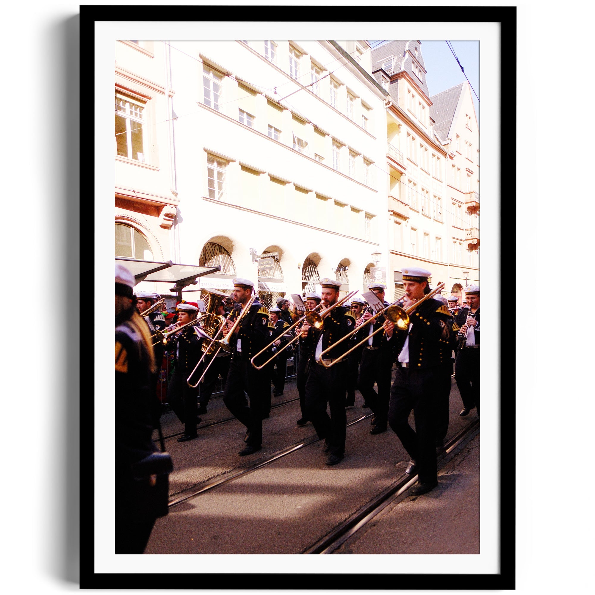 Framed fine art photograph of a marching band in Wiesbaden, capturing vibrant street culture, available at The Dana Gallery in Miami.
