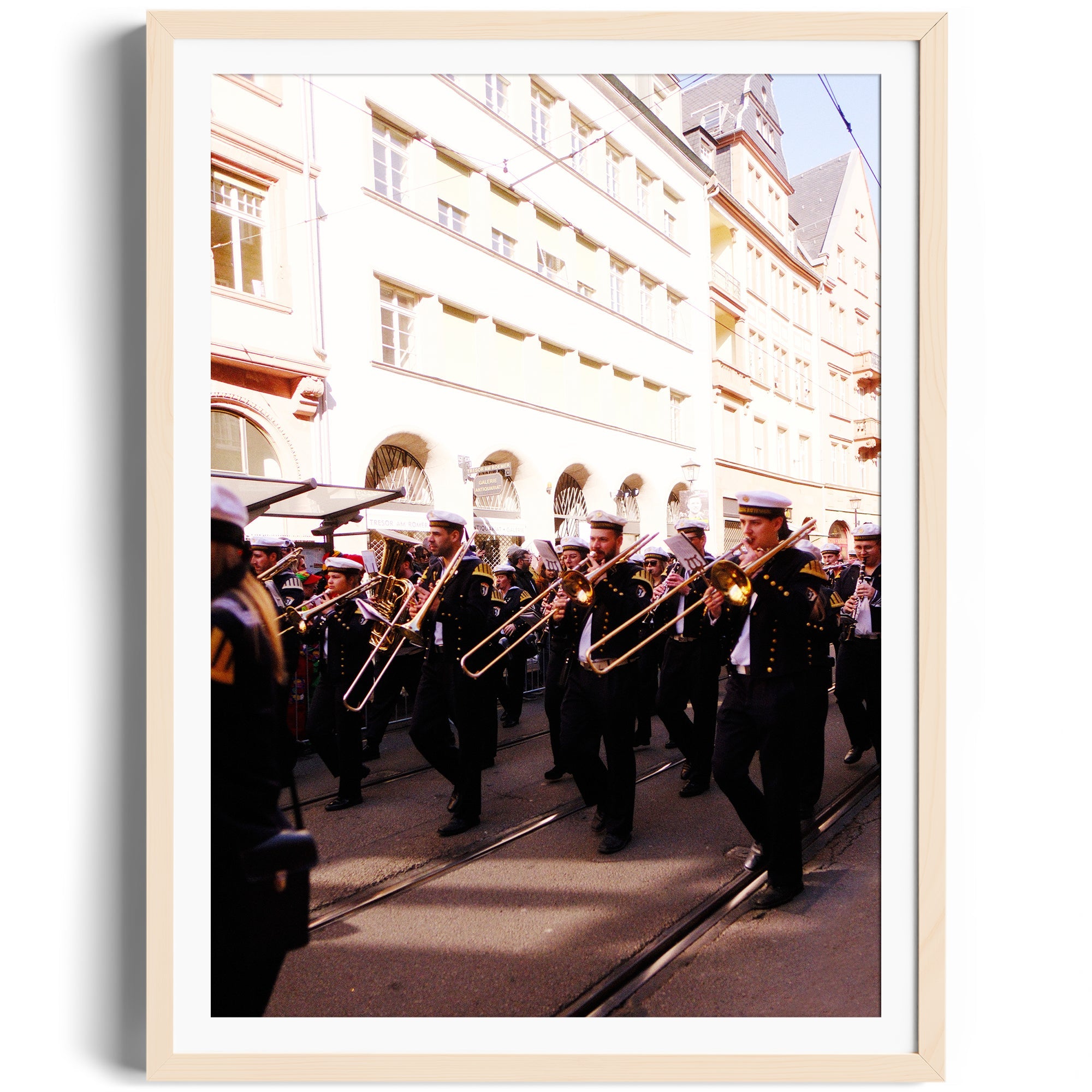 Military band in parade attire playing trombones on city street, framed fine art photography by Marcelo Cadavid.