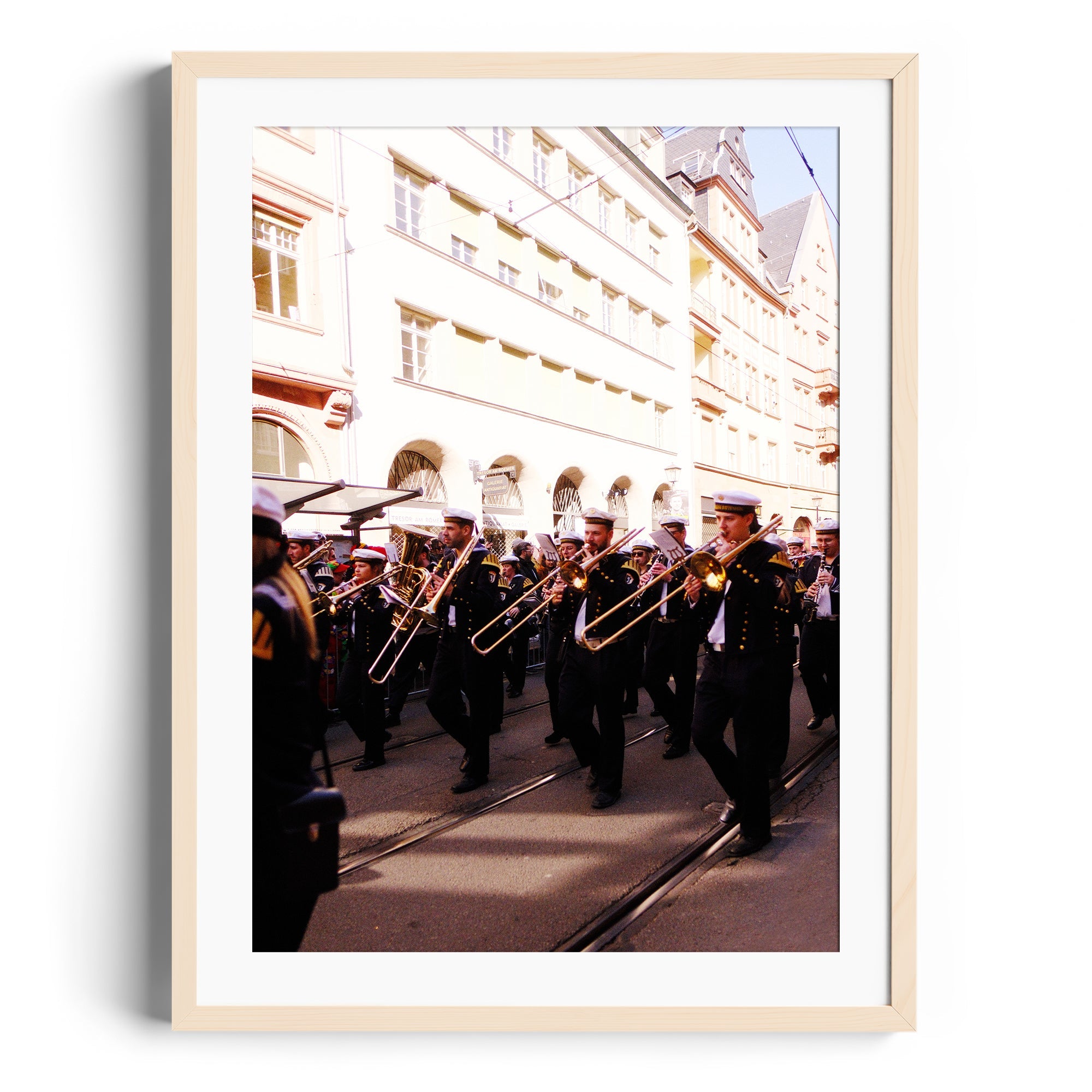 Framed fine art photography of a brass band performing in the streets, capturing musical expression and vibrant culture.