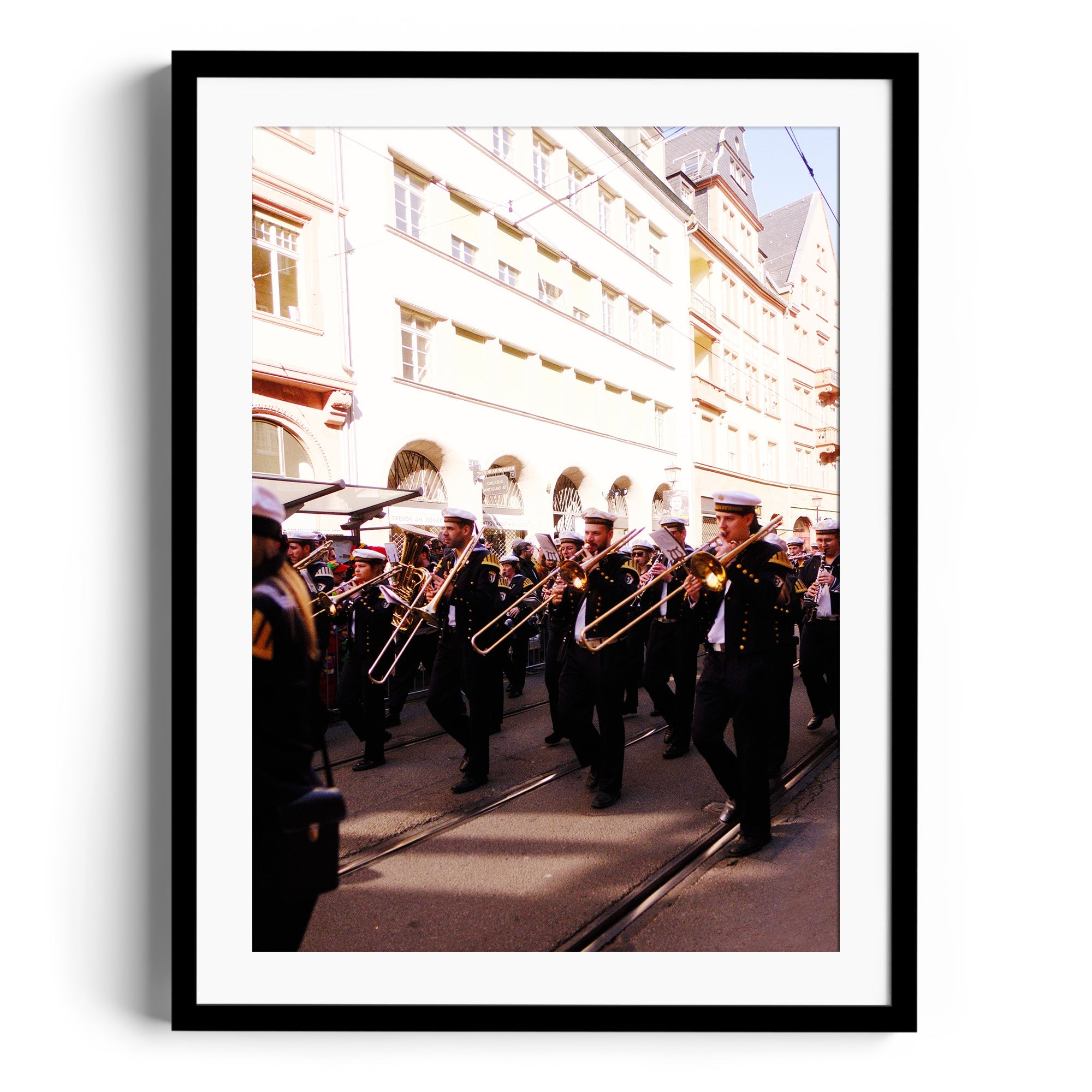 Framed fine art photography of a brass band parade, showcased in The Dana Gallery, Miami, Florida.