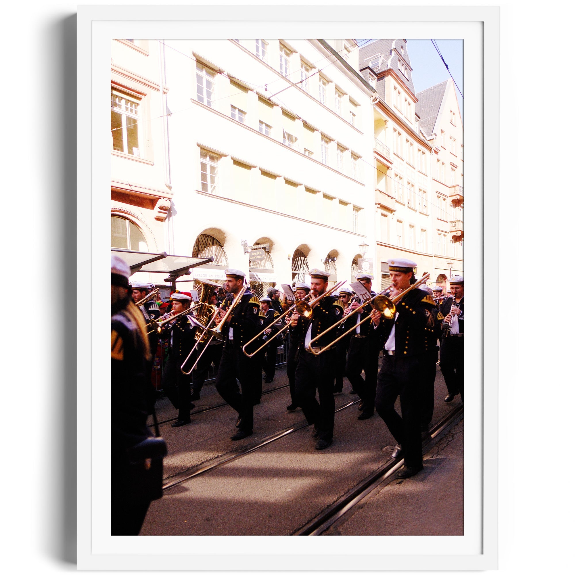 Dynamic street procession featuring musicians with trombones in a vibrant urban setting, framed fine art photography.