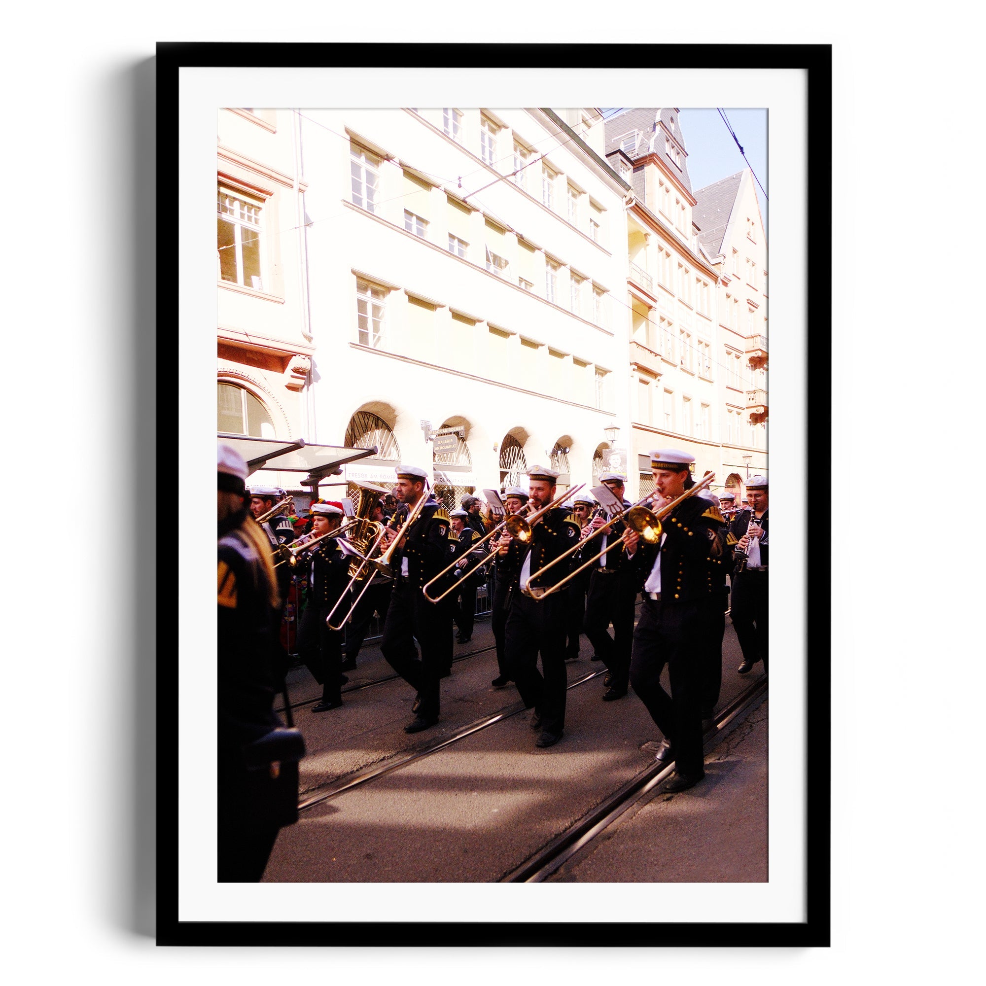 Marching band featuring trombonists in performance on a city street, framed fine art photography by Marcelo Cadavid.