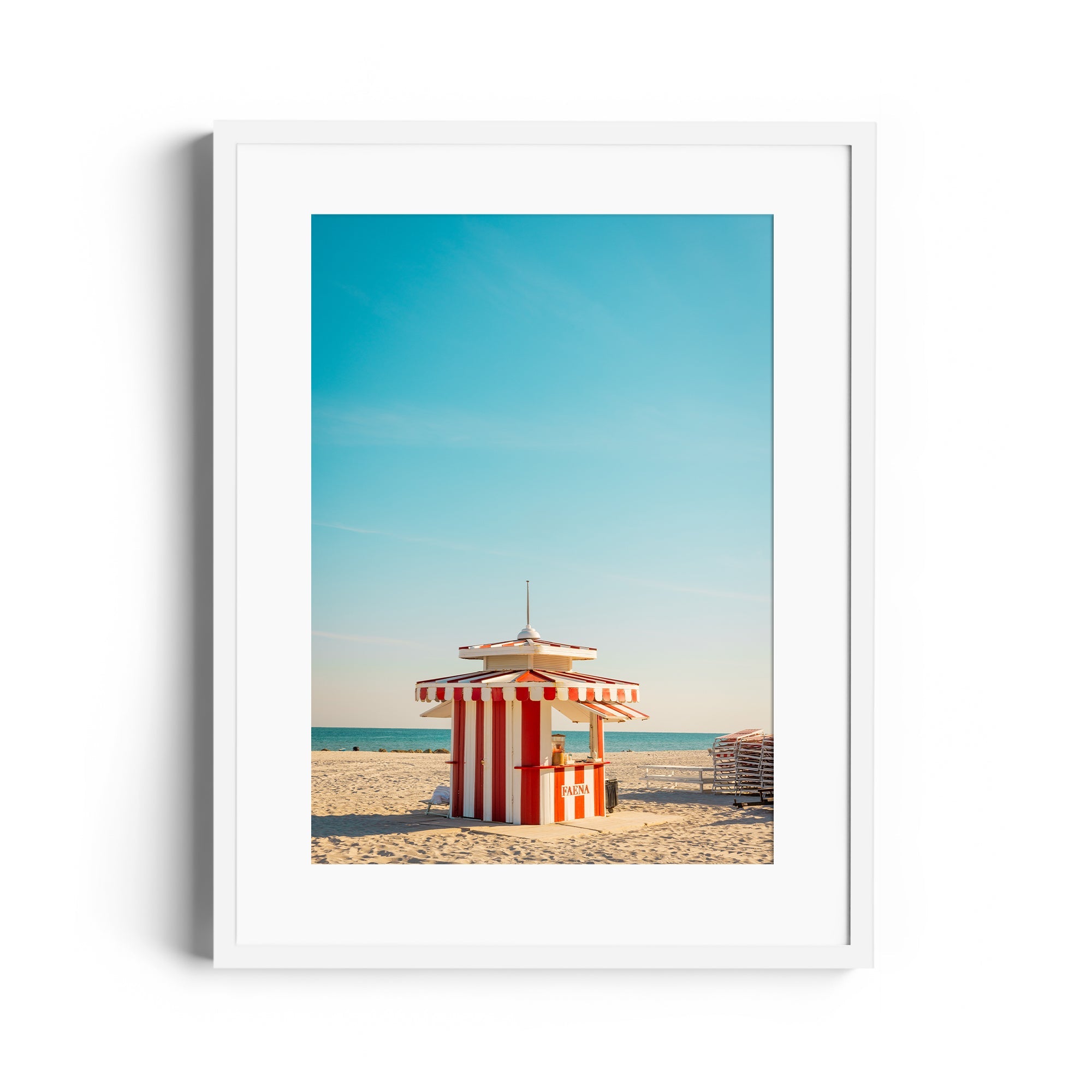 Framed fine art photograph of a red and white striped beach hut in Miami, Florida, capturing vibrant coastal scenery.