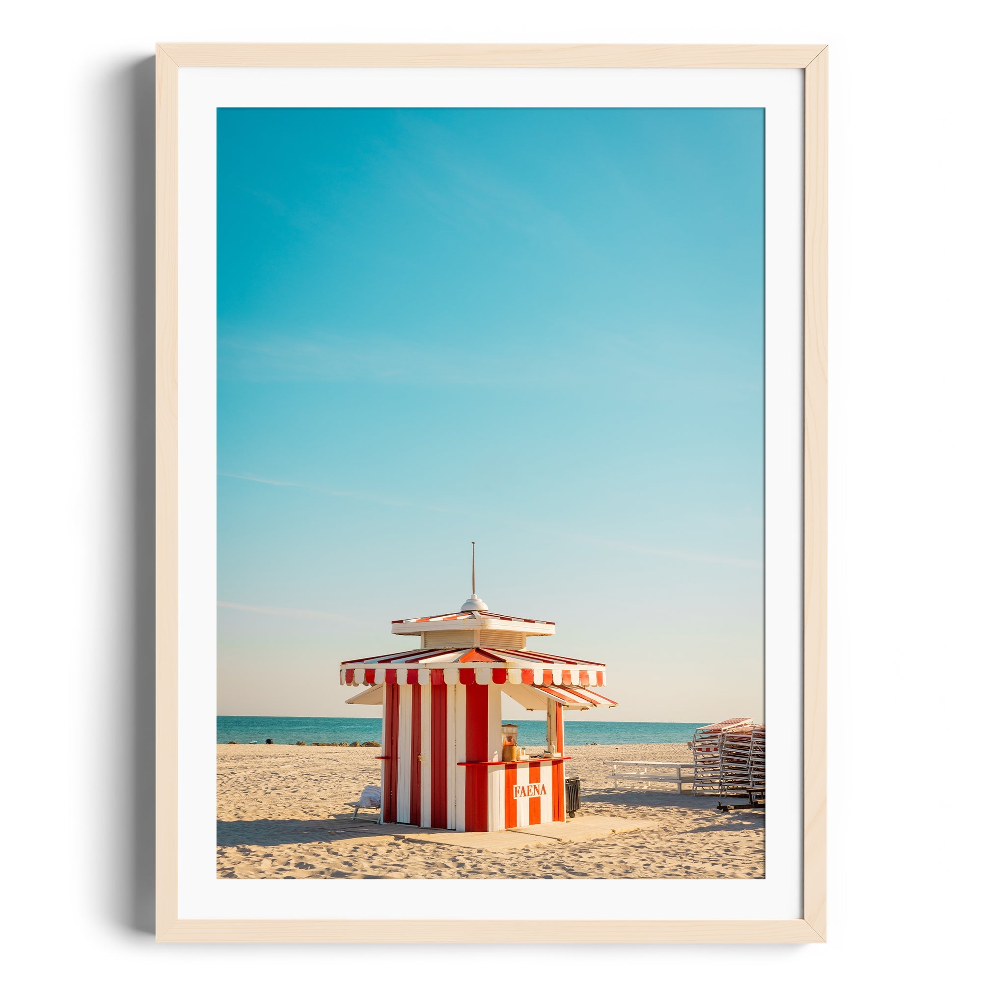 Framed fine art photography of a striped beach cabana in Miami against a clear sky, by George Lozada.