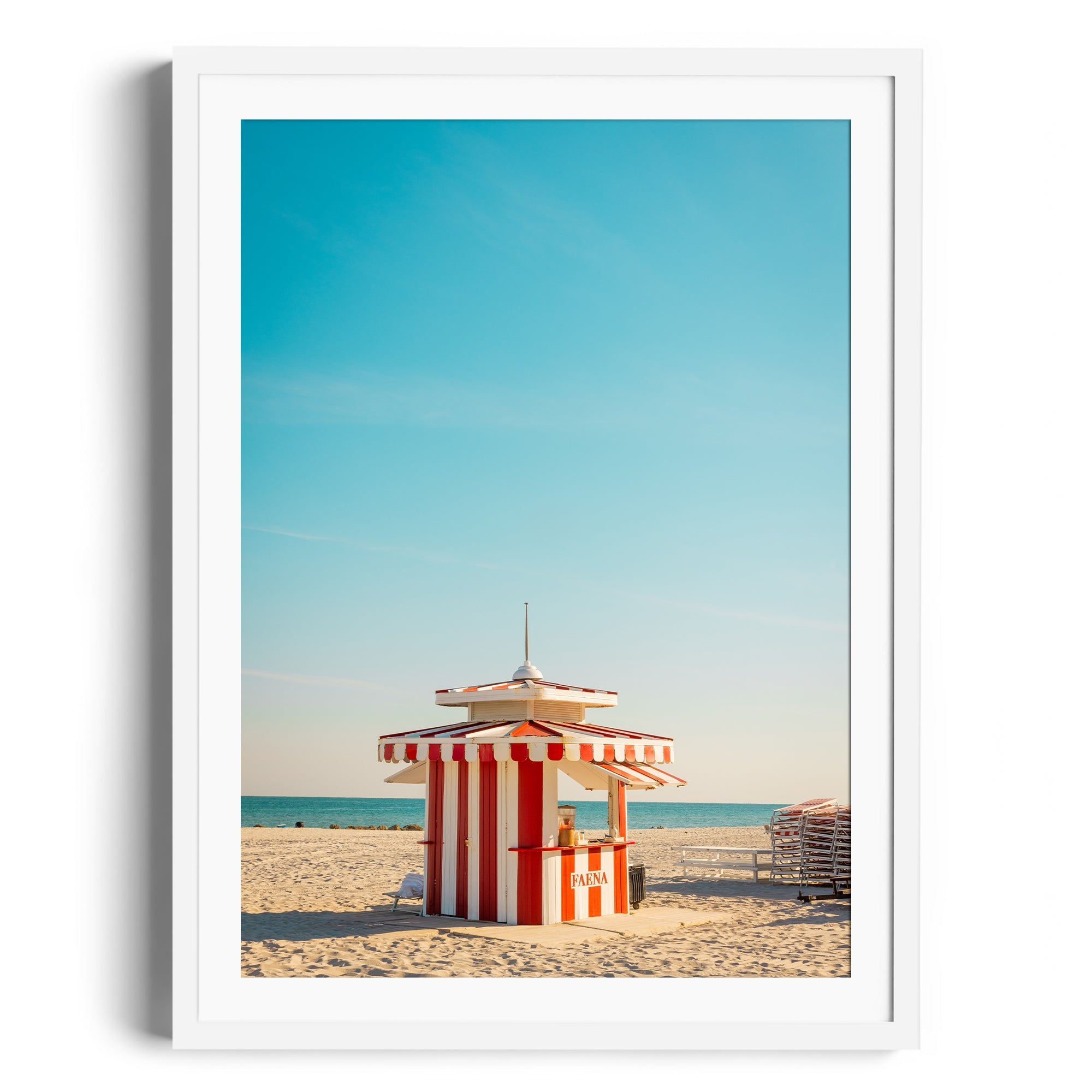 Framed fine art photography of a red and white beach hut on Miami beach, capturing vibrant coastal life.