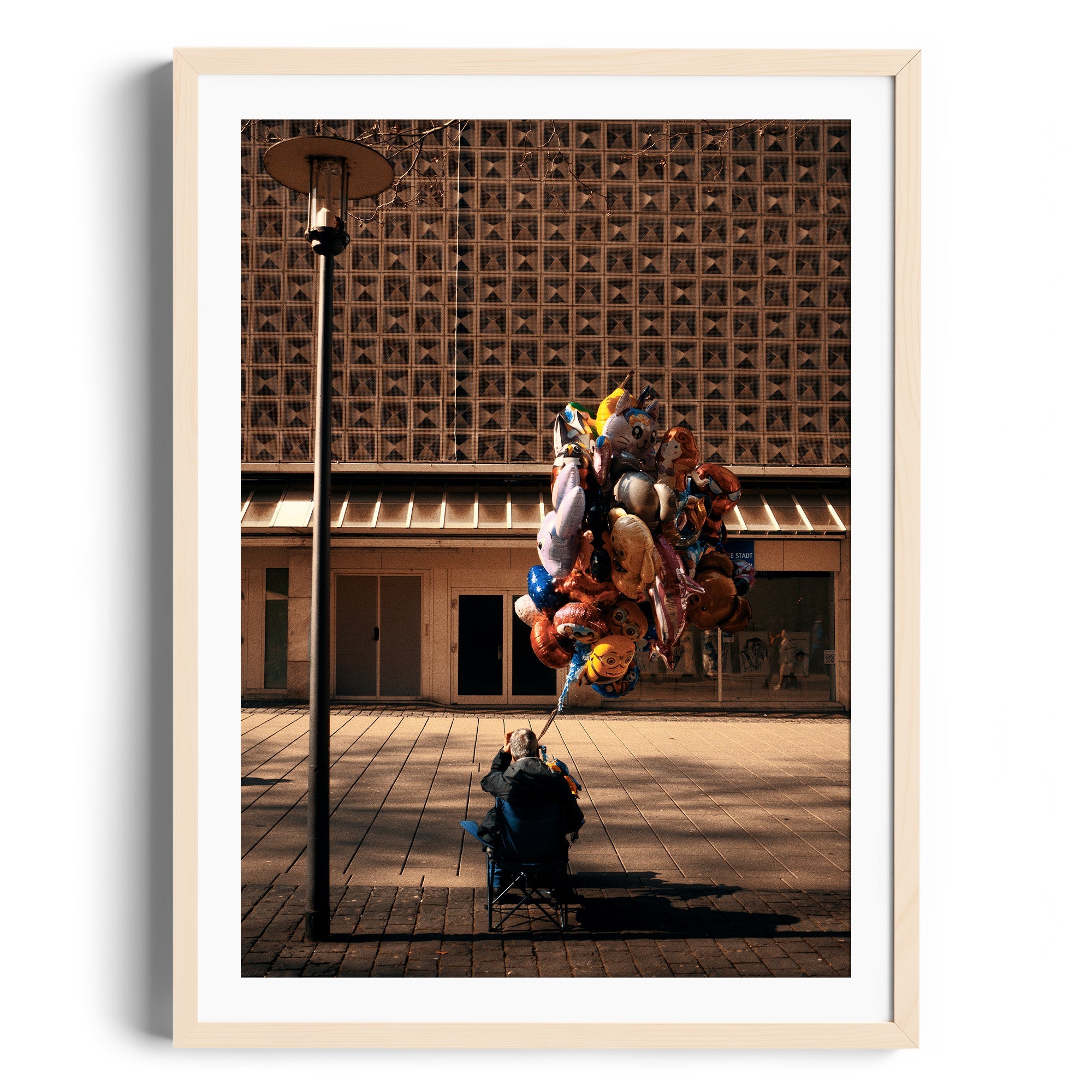 Framed fine art photograph of a person sitting with colorful balloons in an urban setting, captured in Miami, Florida.