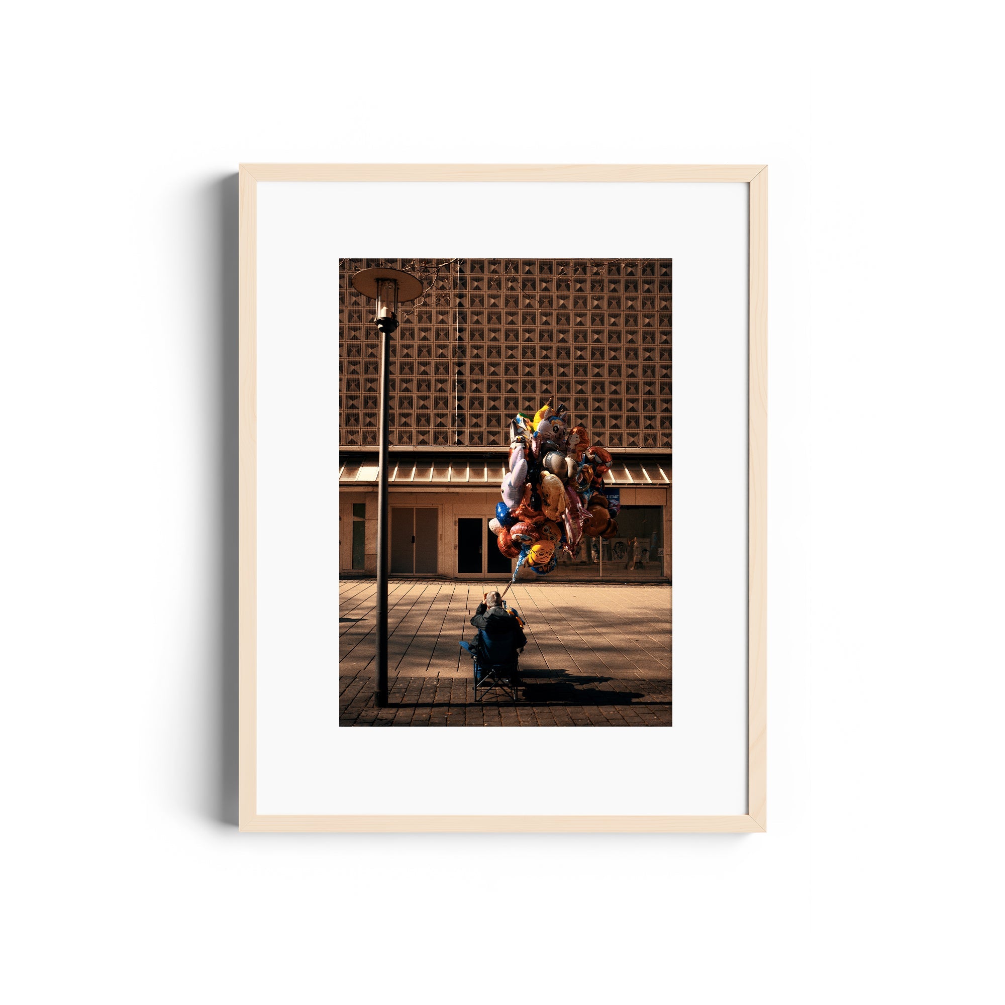 Framed fine art photograph titled 'UP' by Marcelo Cadavid featuring a person with colorful balloons.