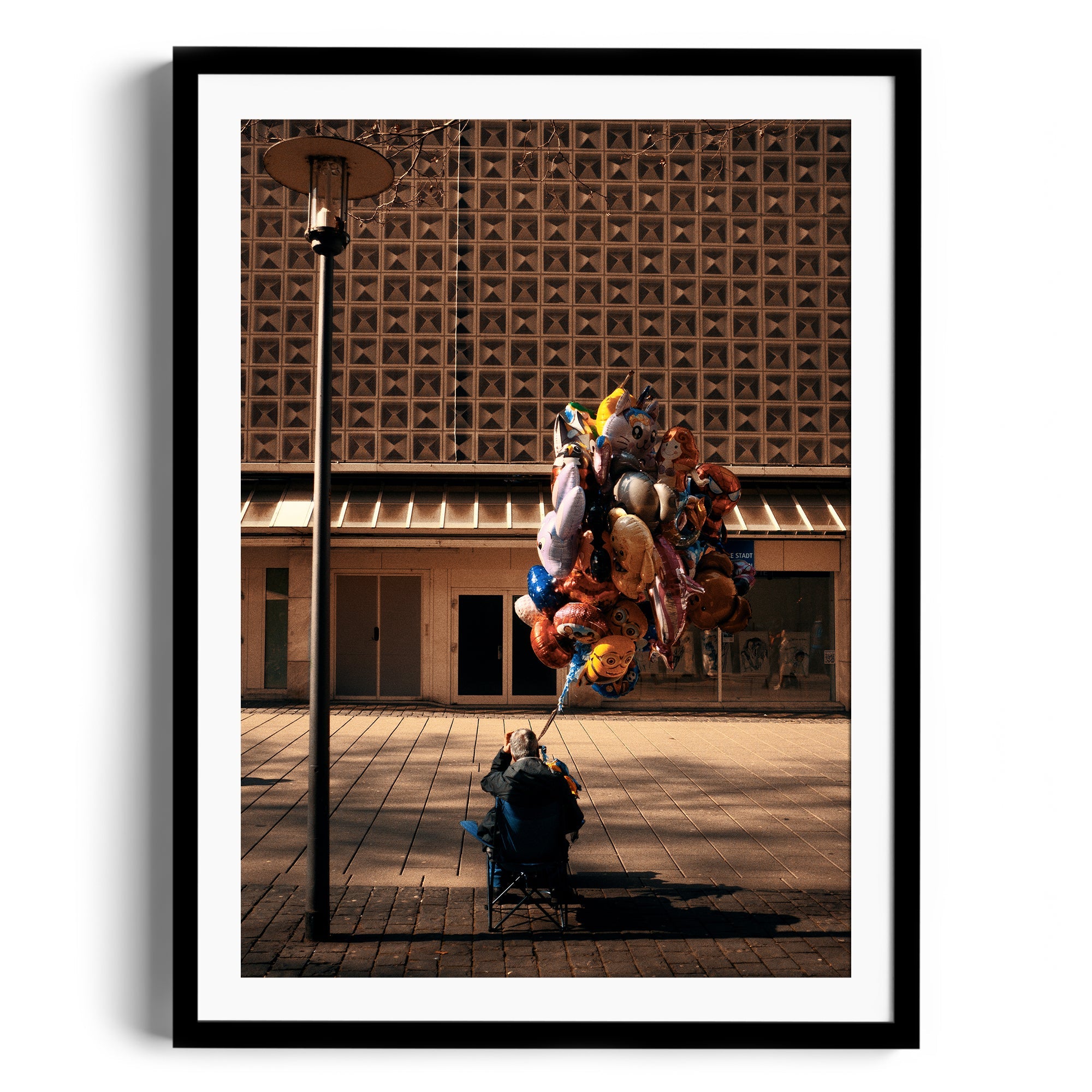 Framed fine art photograph of a person with colorful balloons in an urban setting, from The Dana Gallery, Miami, Florida.