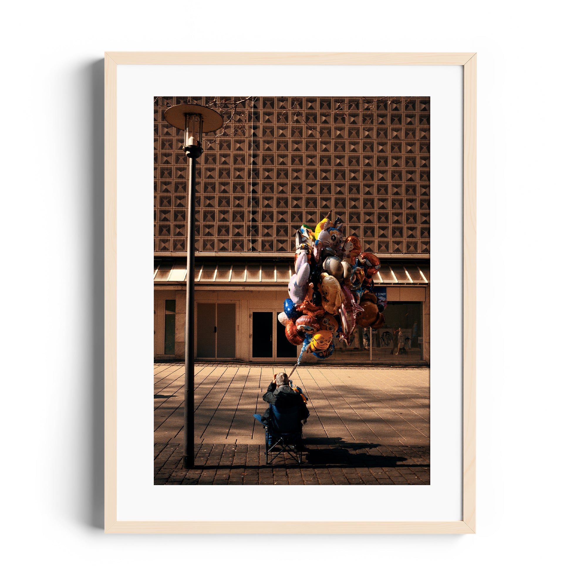 Fine art photography 'UP' by Marcelo Cadavid, featuring a man with colorful balloons in Miami, available at The Dana Gallery.