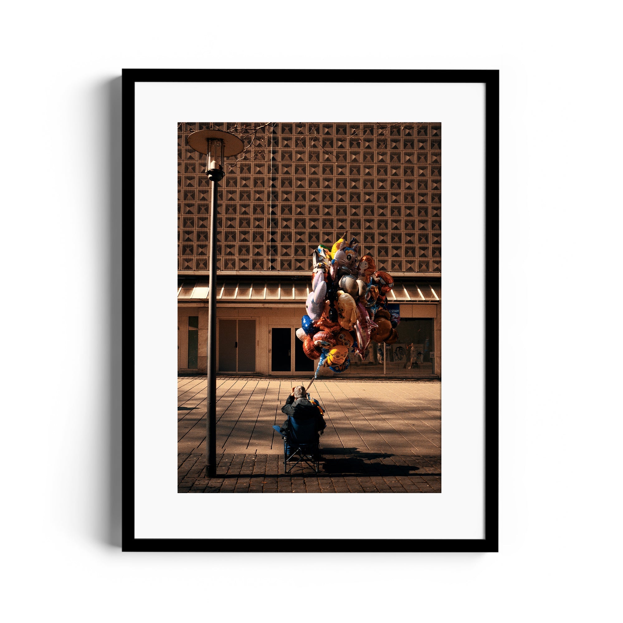 Framed fine art photograph of a person with colorful balloons, featured at The Dana Gallery, Miami, Florida.