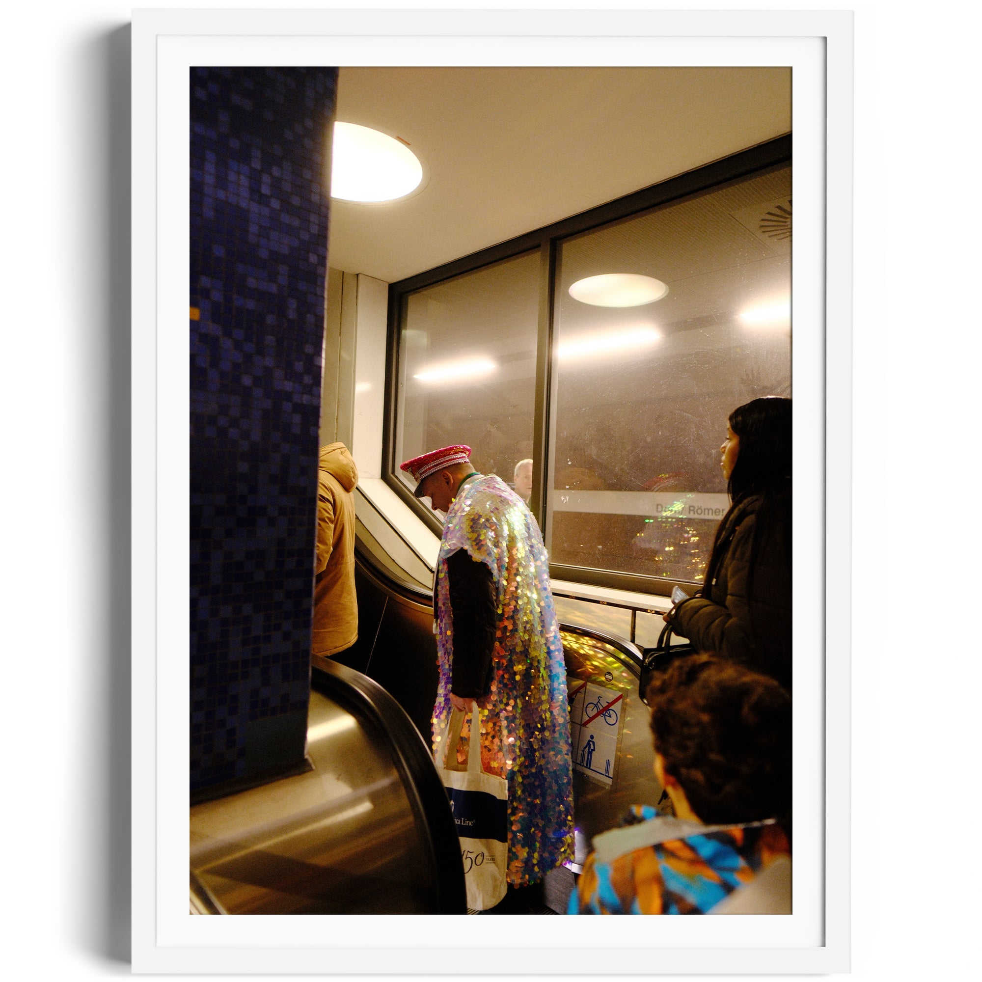 A colorful, sequined-clad figure ascending an escalator, showcasing urban fashion and culture.