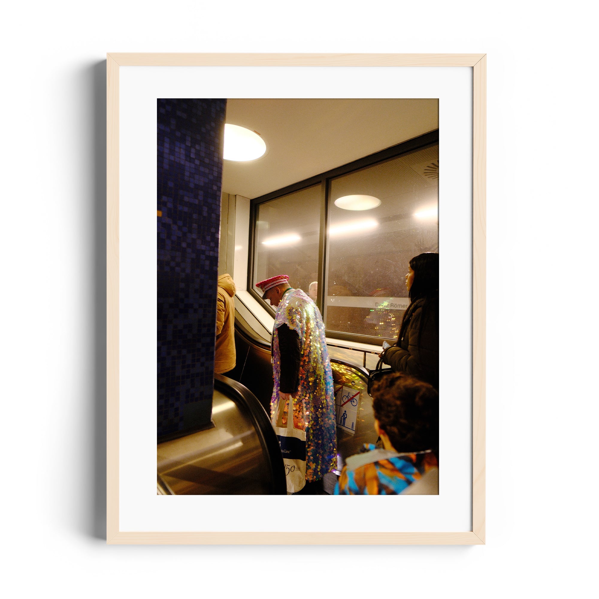 Framed fine art photo of a colorful figure in a unique cape on an escalator, capturing urban life in Miami.