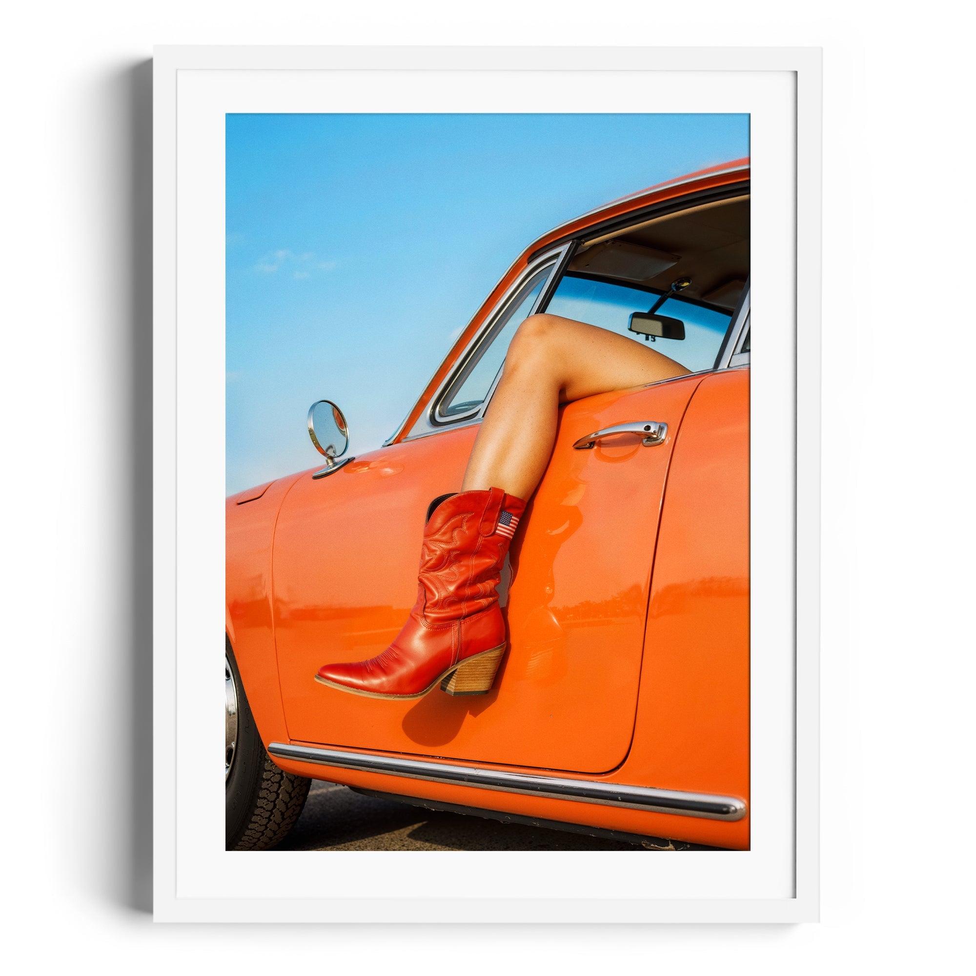 Red cowgirl boots displayed in a framed photo, showcasing fine art style in Miami. Perfect for gallery settings.