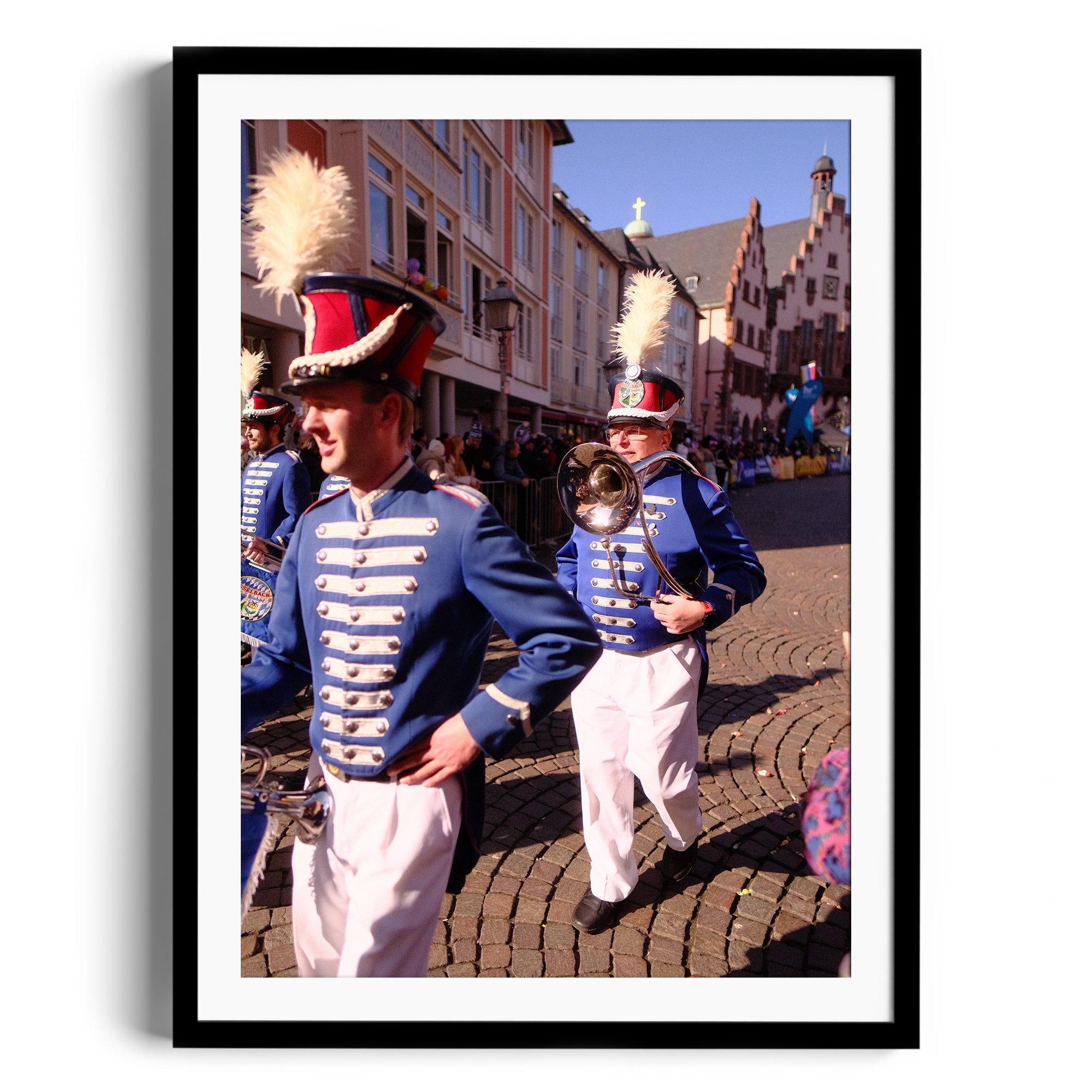 Marching band performers in vibrant uniforms during a street festival, framed fine art photography.