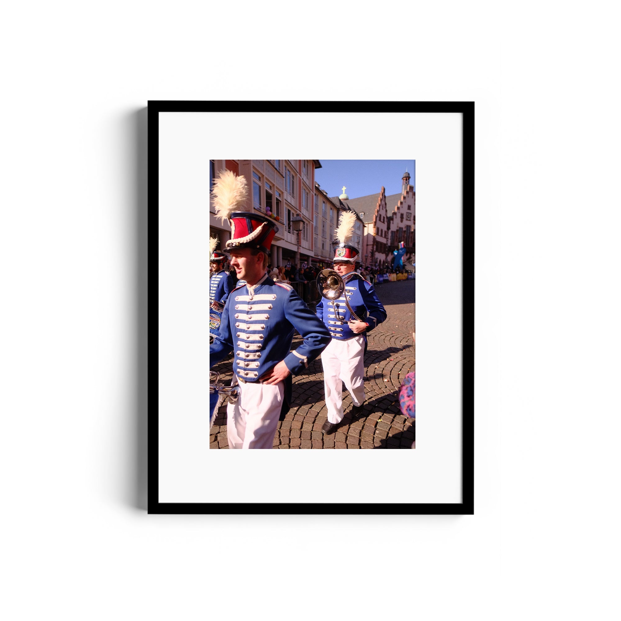 Framed fine art photograph of musicians in blue uniforms at a parade, by Marcelo Cadavid, showcased at The Dana Gallery, Miami.