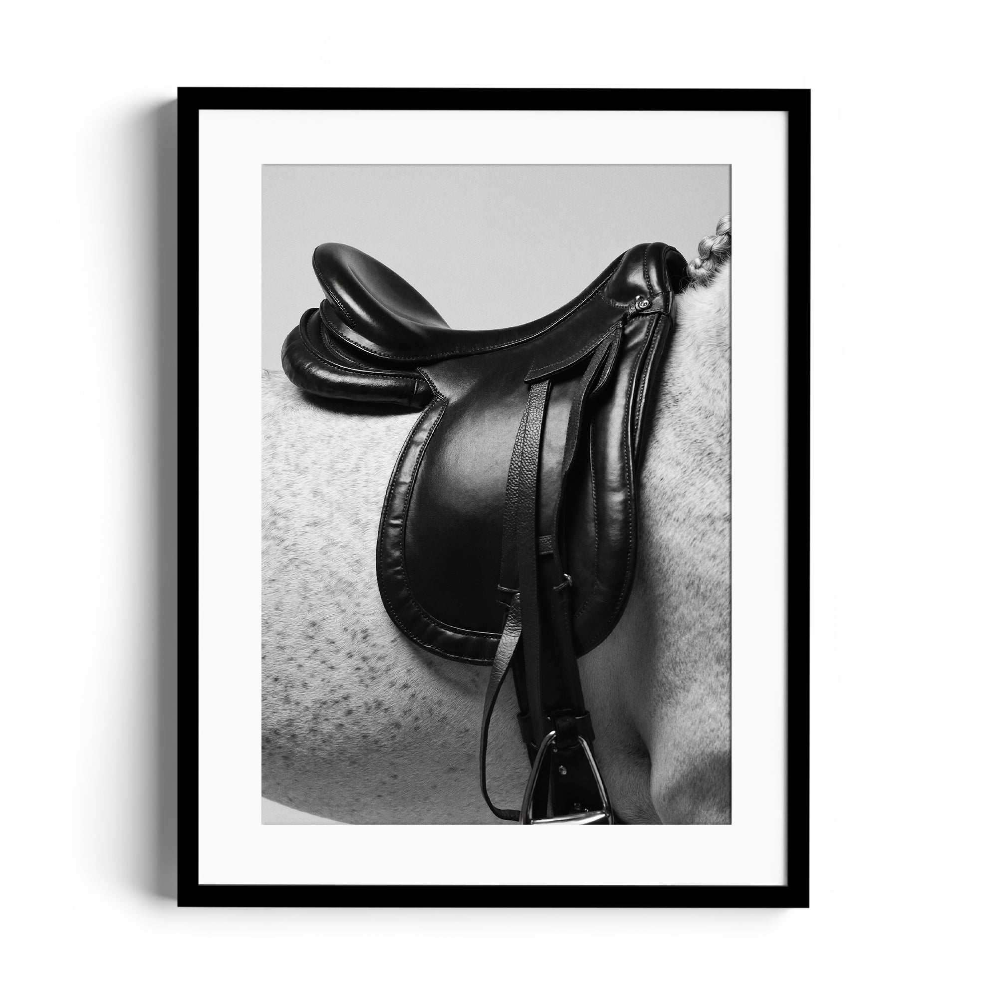 Monochrome artwork featuring an elegant English saddle on a dappled grey horse, showcasing fine art and craftsmanship in Miami.