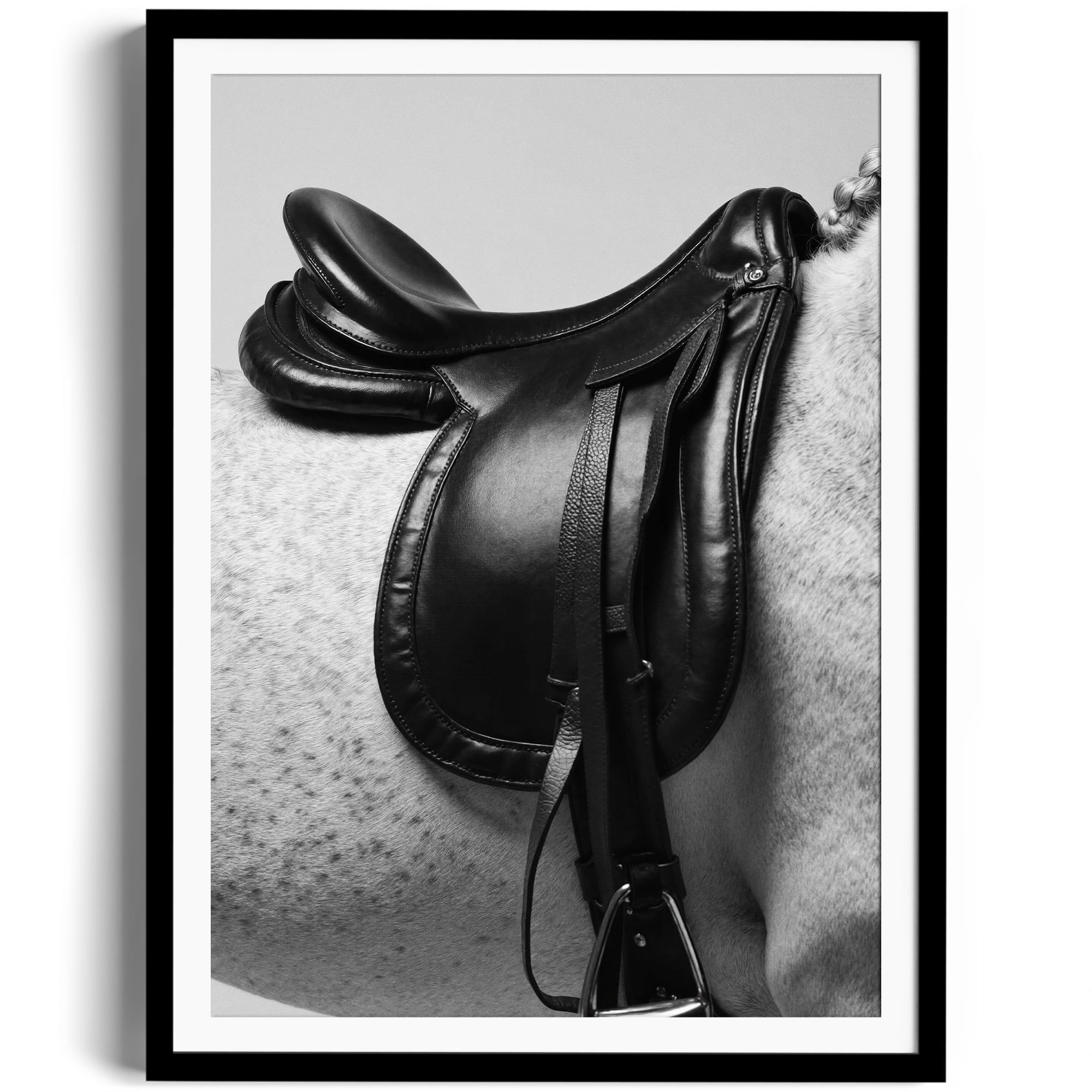 Limited edition fine art print of a black English saddle on a dappled grey horse, highlighting equestrian elegance in Miami.