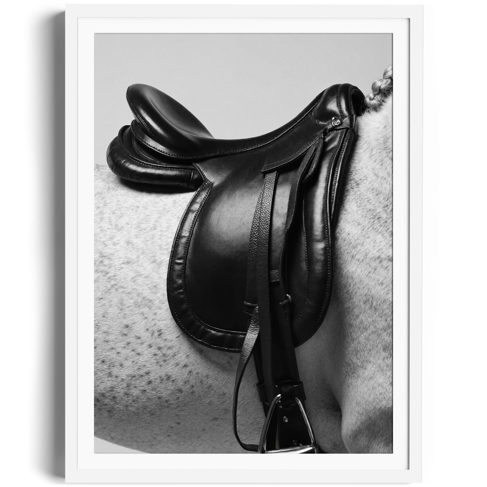 Limited edition fine art print of English saddle on a dappled grey horse, showcasing equestrian elegance and craftsmanship.