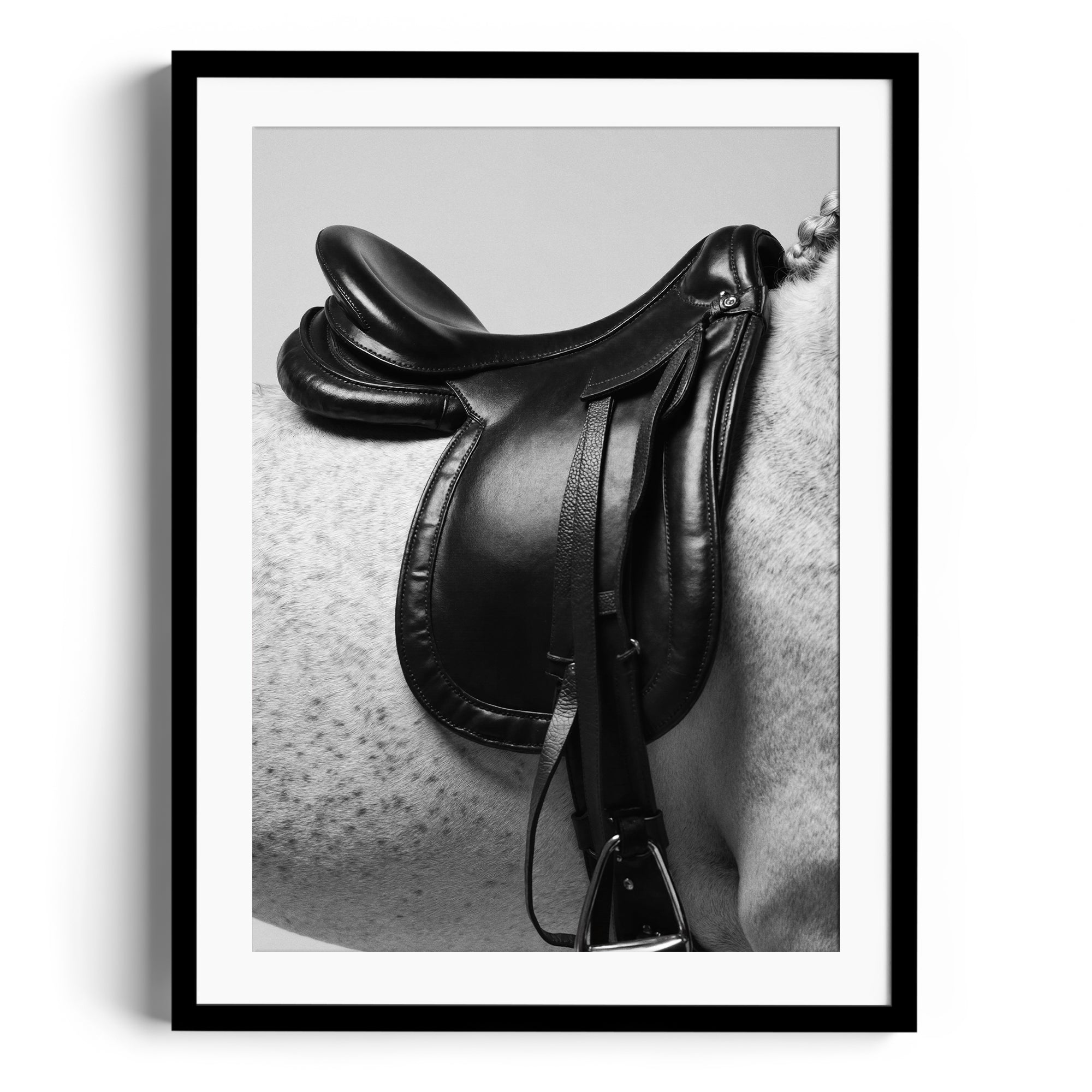 Limited edition print of an English saddle on a dappled grey horse, showcasing equestrian elegance and craftsmanship. Fine art Miami.