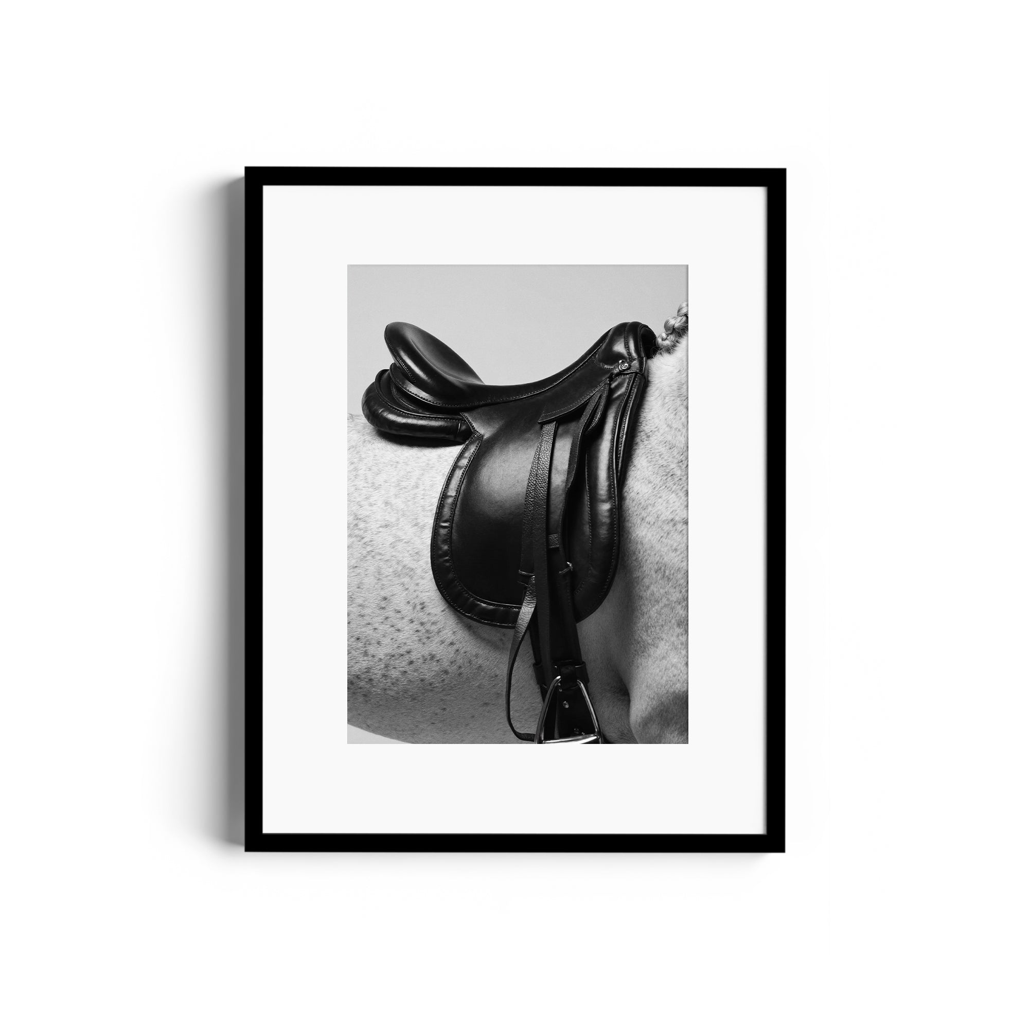 Monochromatic fine art print of an English saddle on a dappled grey horse, showcasing equestrian elegance in Miami gallery.