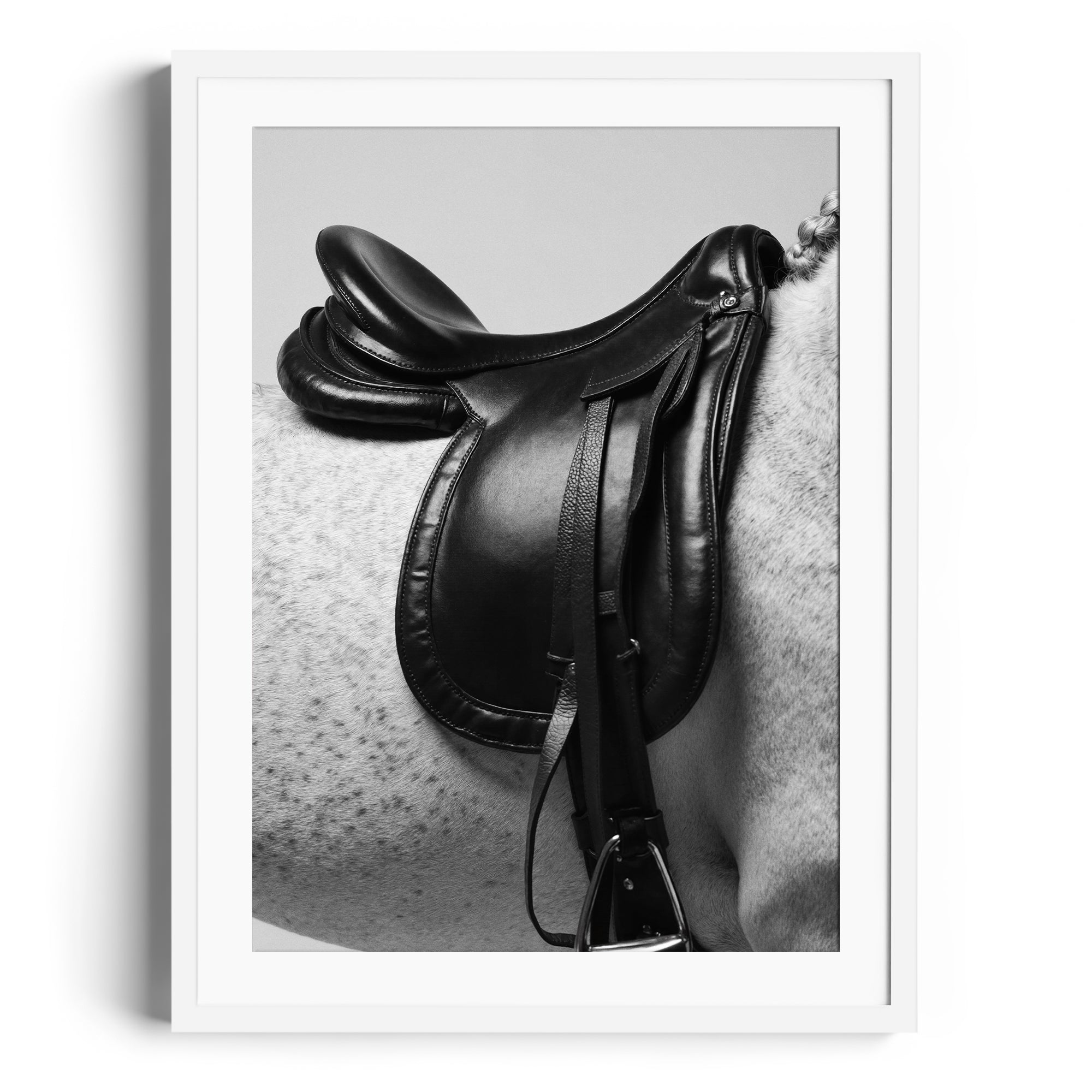 Limited edition fine art print of a black English saddle on a dappled grey horse, showcasing equestrian elegance. Miami gallery display.