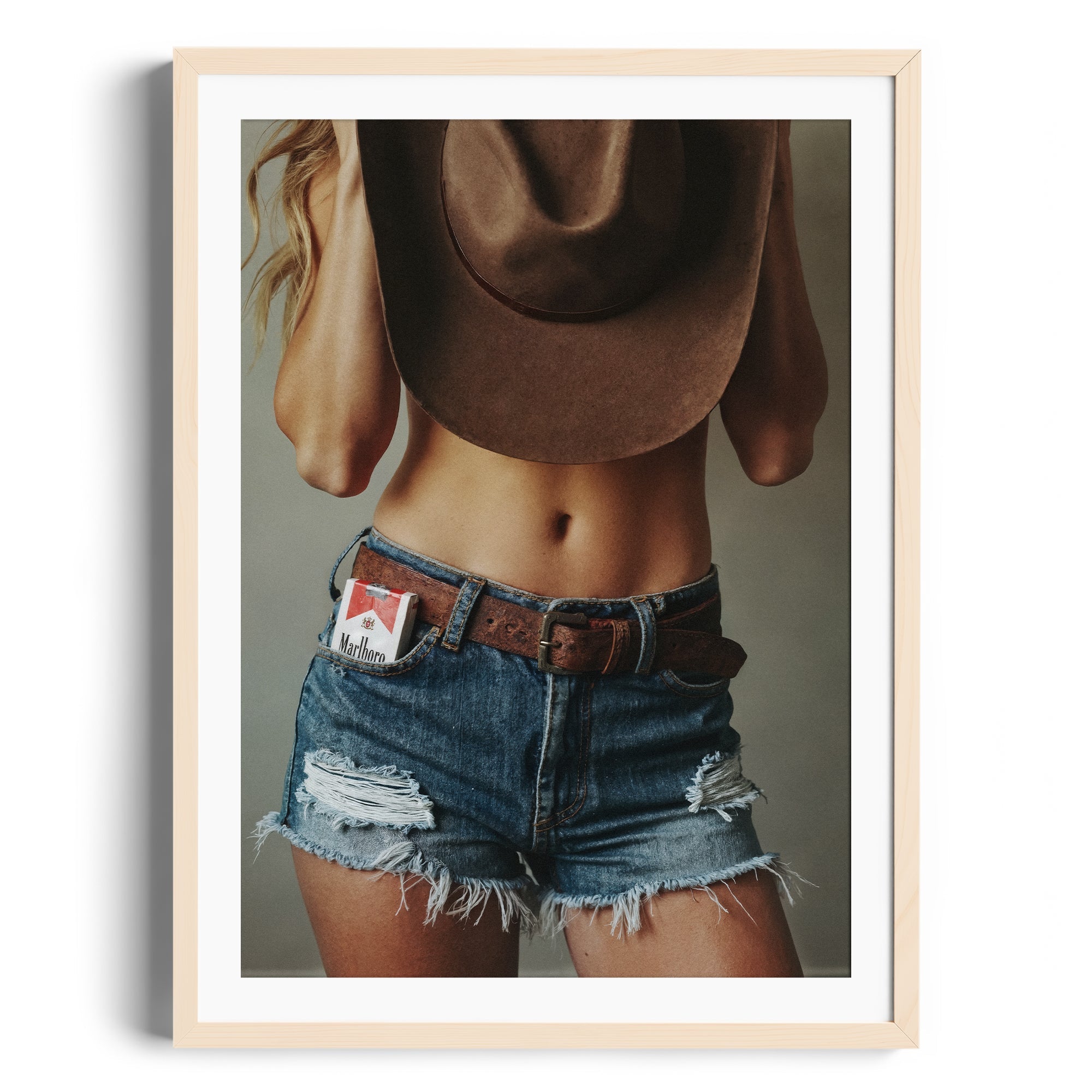 Limited edition fine art photography DIAMONT featuring distressed denim shorts, cowboy hat, and bold attitude. Print for art gallery Miami.