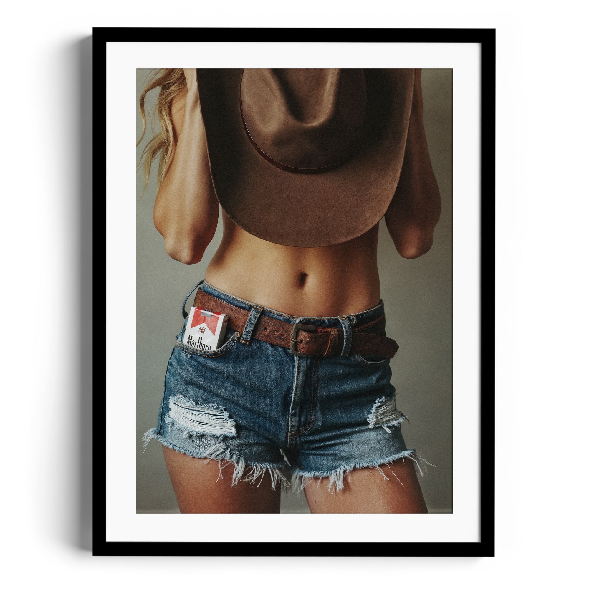 Limited edition fine art print "DIAMONT" by Diego Cadavid, showcasing a confident model in distressed denim and cowboy hat.