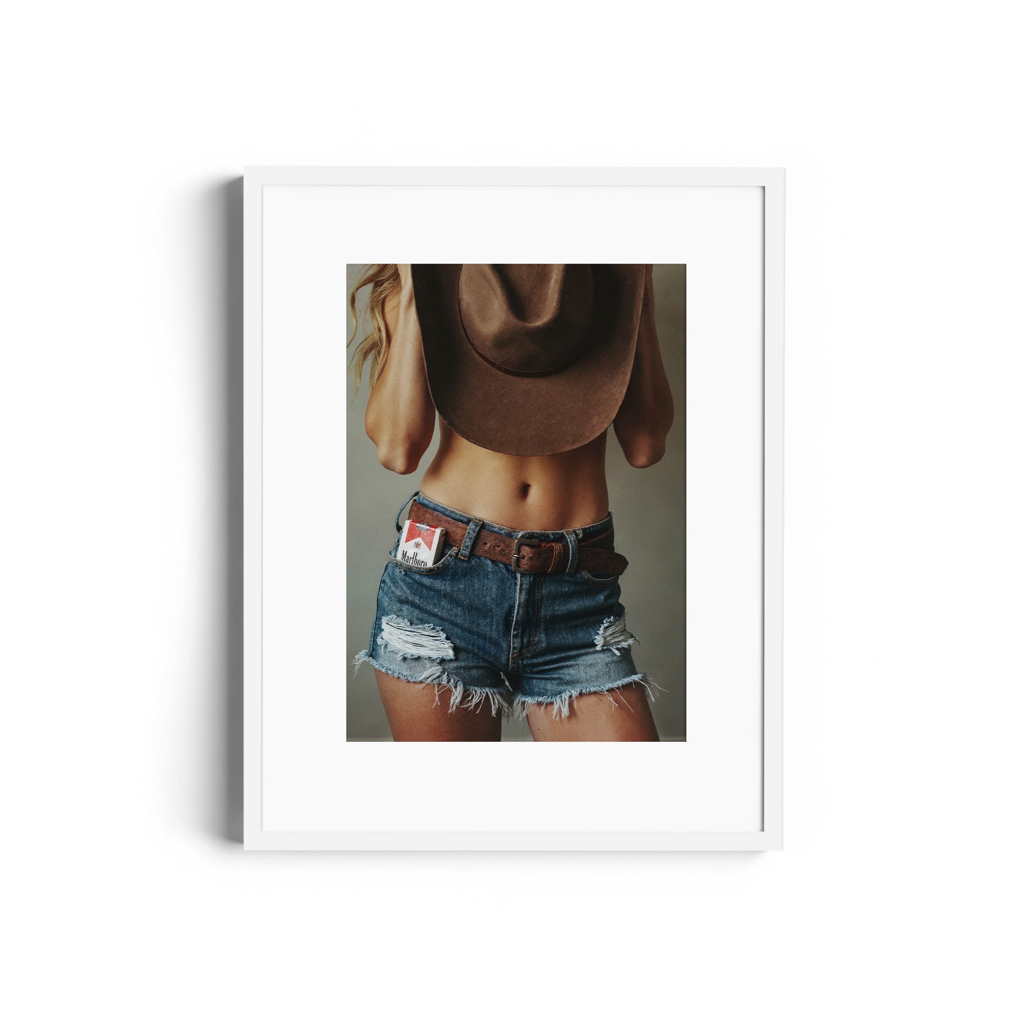 Limited edition fine art photography DIAMONT by Diego Cadavid Mora showcasing a confident figure in denim and a cowboy hat.
