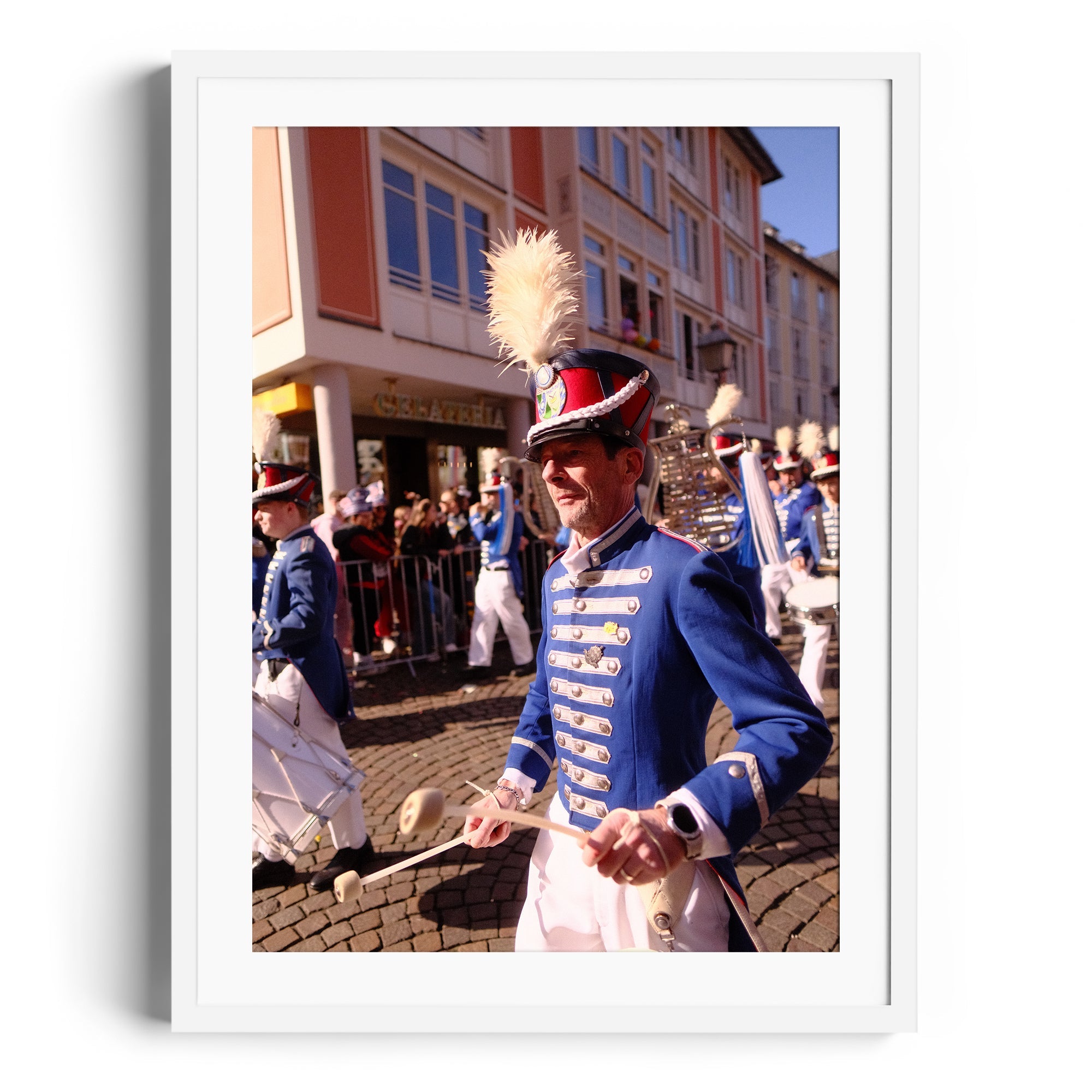Framed fine art photograph of a marching musician in a festive parade in Wiesbaden, Germany, capturing vibrant colors and energy.