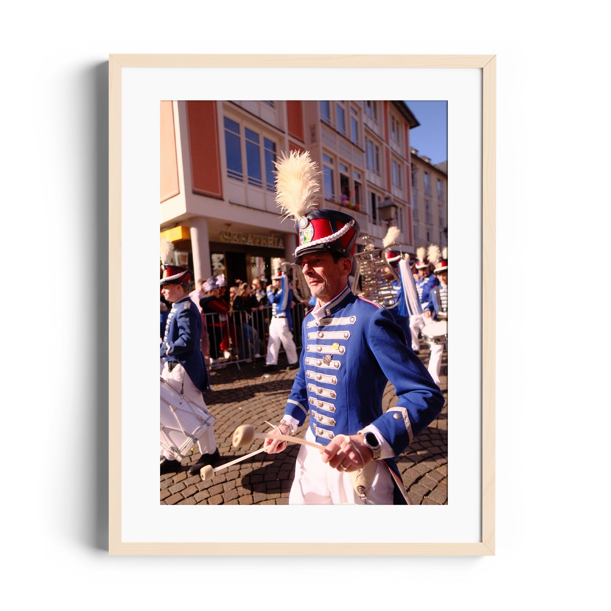 Celebrating musical tradition: a musician in blue uniform marching during a parade, captured in fine art photography.