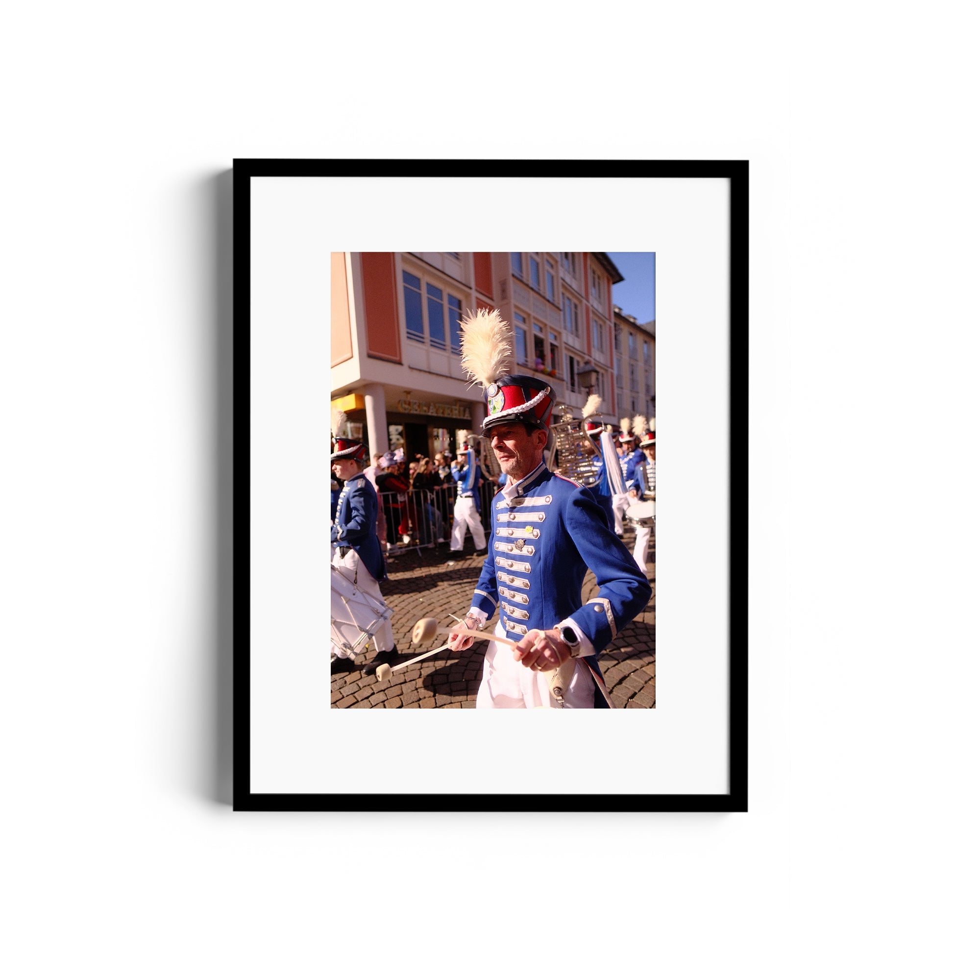 Framed fine art photograph of a musician in uniform at a parade, capturing vibrant street life in Wiesbaden, Germany.