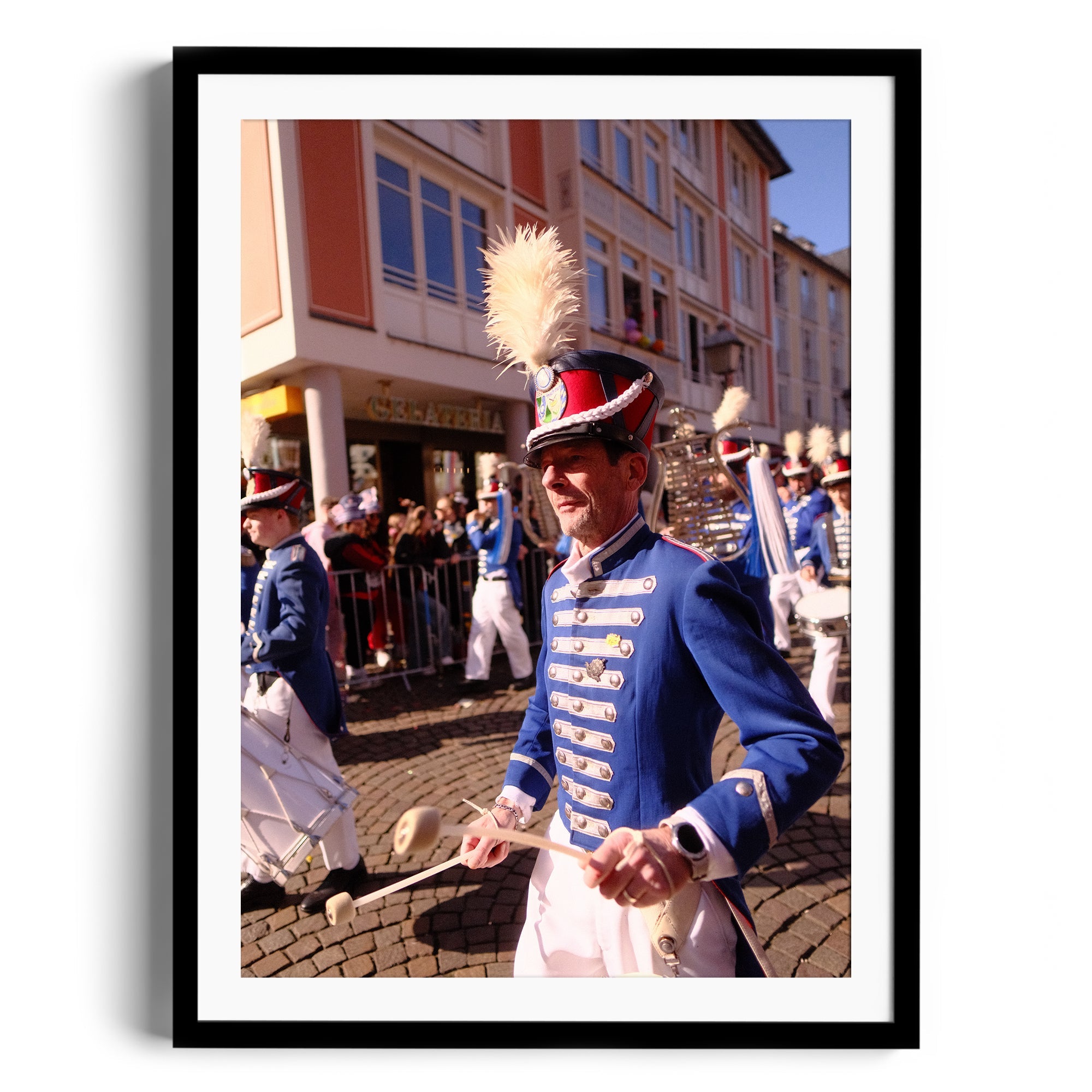 Framed fine art photography of a marching band member in vibrant blue uniform at a parade in Wiesbaden, Germany.