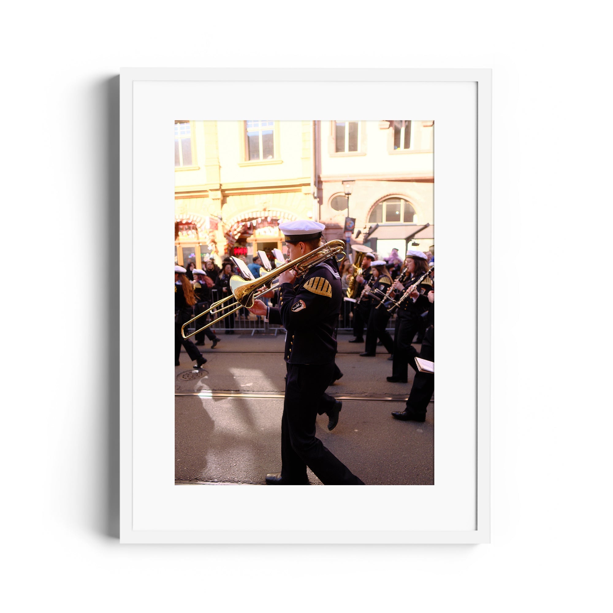 Limited edition framed fine art photograph of a musician playing trombone at a parade, available at The Dana Gallery in Miami.