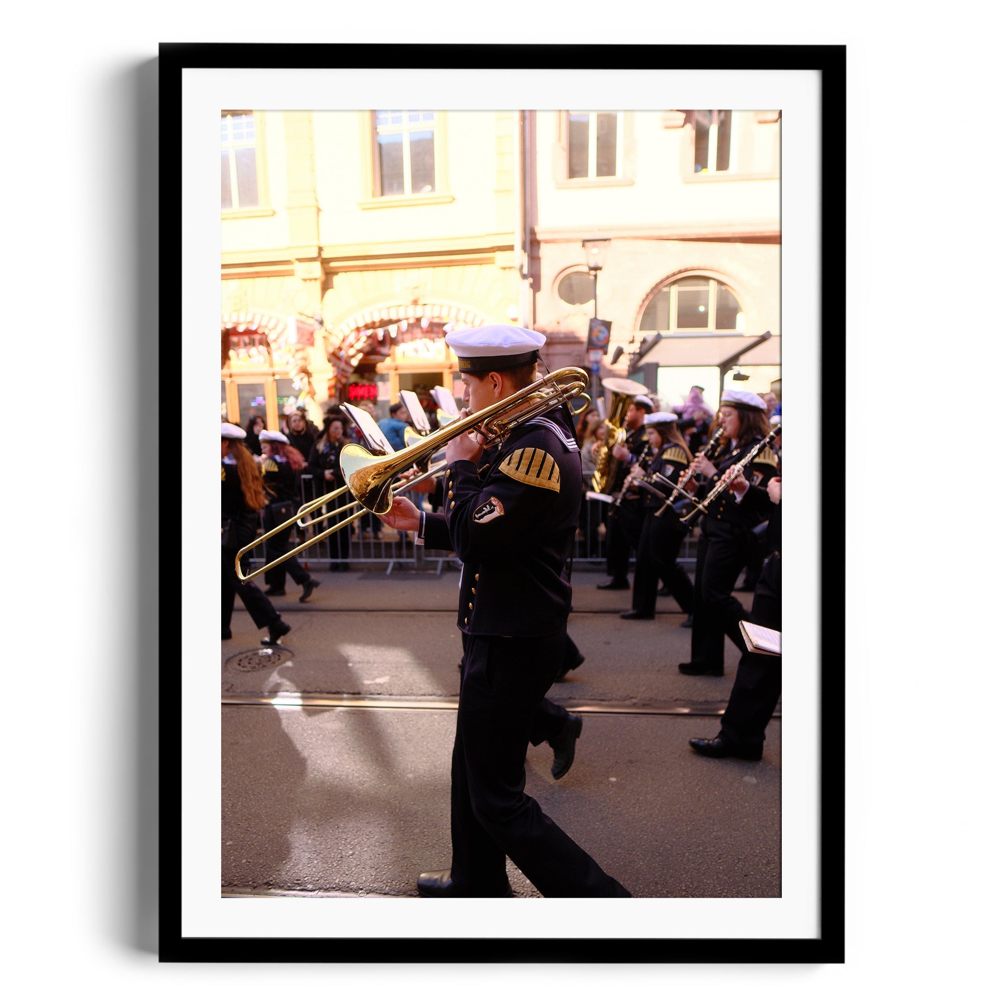 Framed fine art photograph depicting a naval musician playing the trombone during a parade, by Marcelo Cadavid.