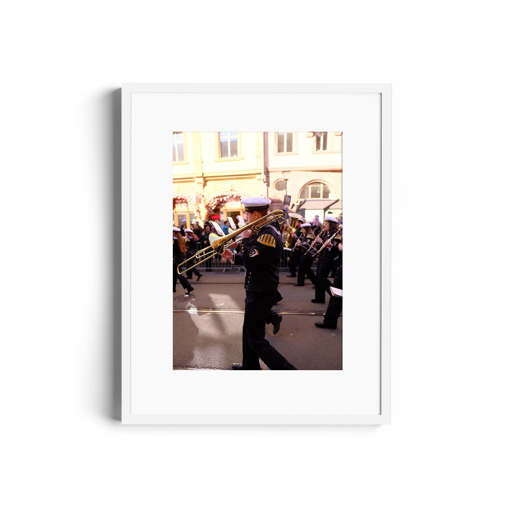 Framed fine art photography of a musician playing a trombone in a parade, available at The Dana Gallery, Miami, Florida.