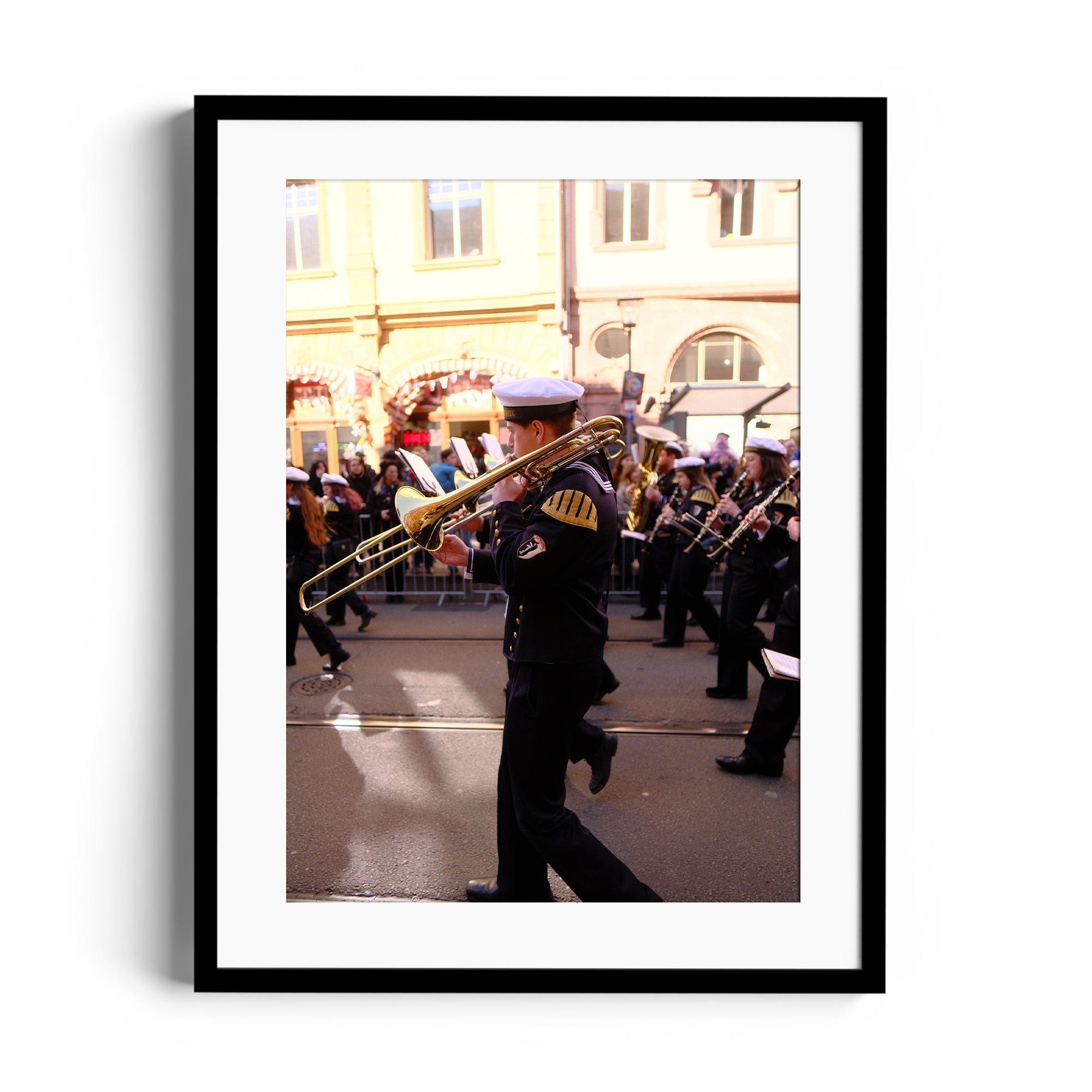 Framed fine art photograph of a musician playing trombone during a parade, featured in The Dana Gallery, Miami Florida.