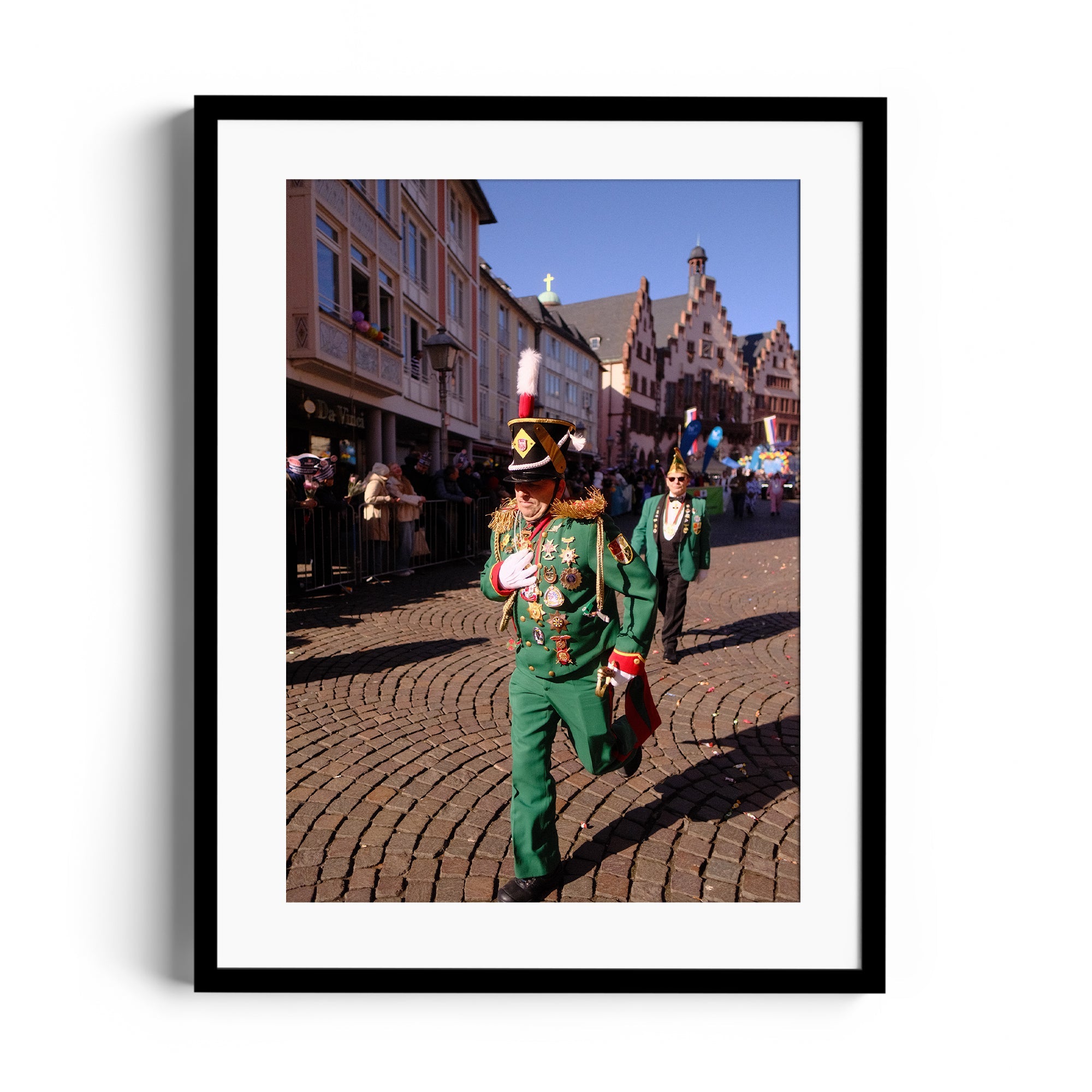 Vibrant parade scene featuring a musician in a green uniform at a festive event, framed art by Marcelo Cadavid.