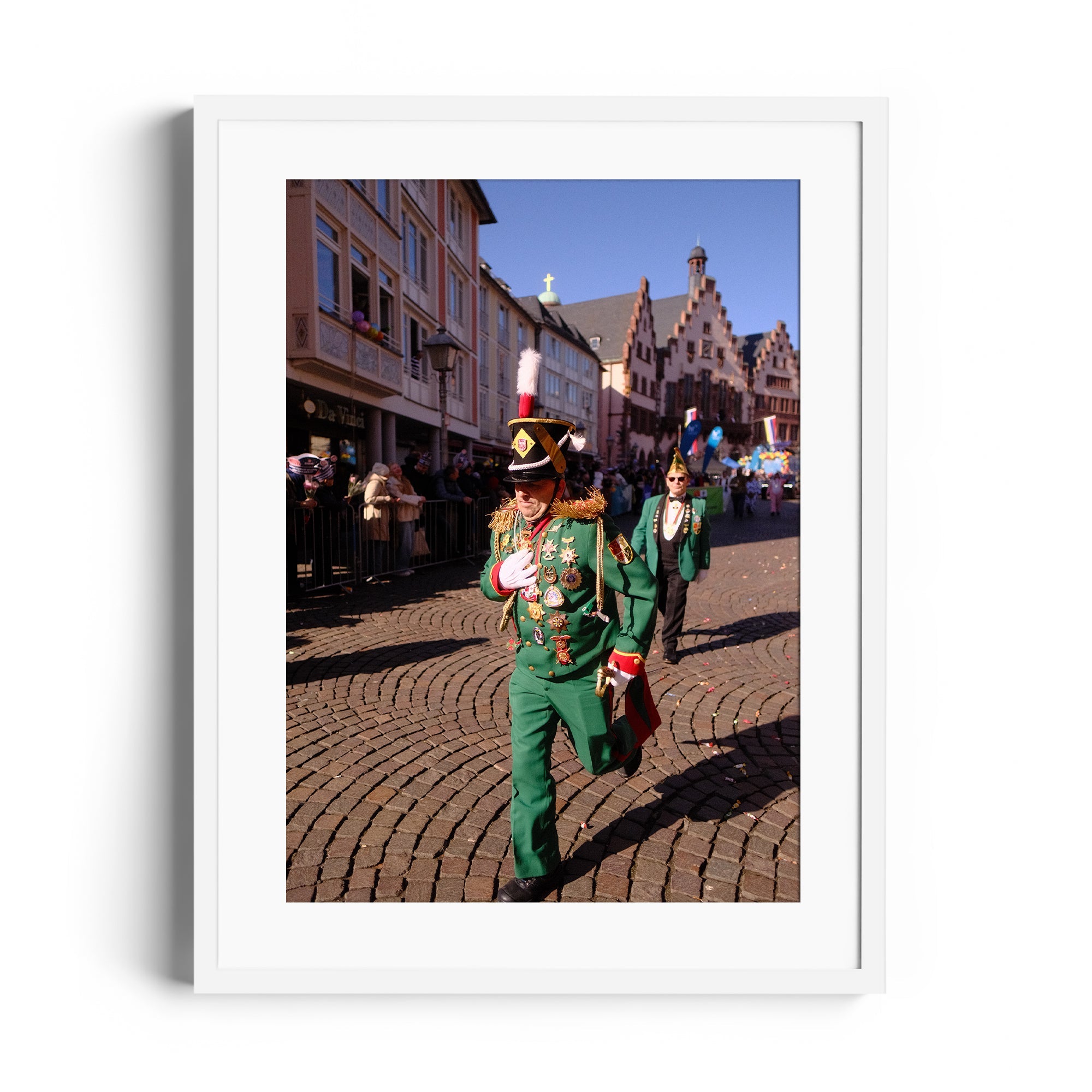 A marching parade scene featuring a man in green attire with medals, captured by Marcelo Cadavid at THE DANA GALLERY in Miami, Florida.