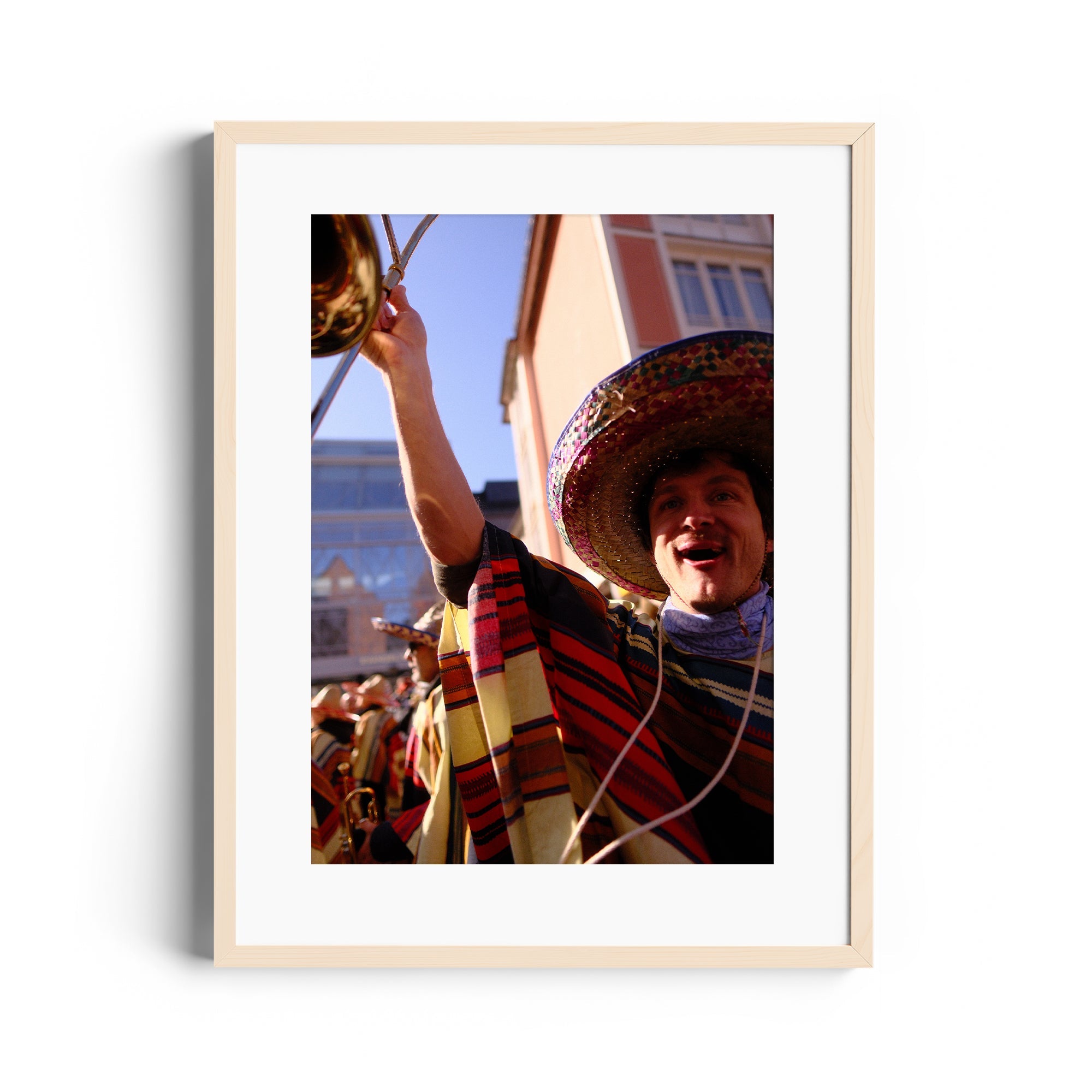 Framed fine art photograph of a mariachi musician celebrating at an outdoor event, showcasing vibrant cultural attire.