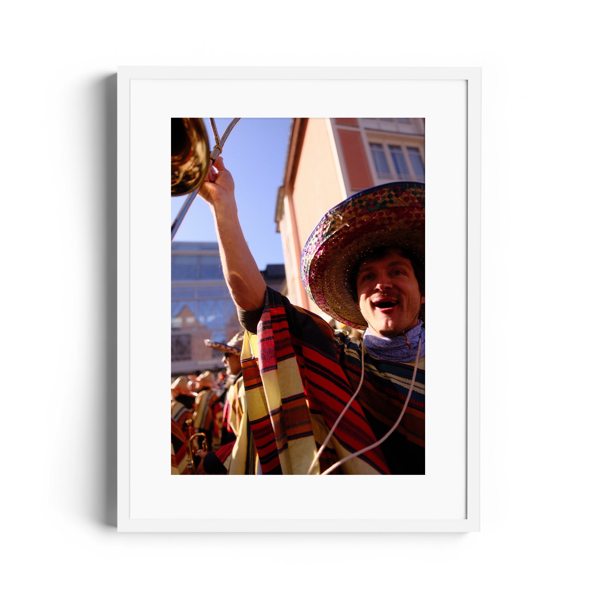 Celebrating musician in colorful attire at a mariachi event, framed fine art photography from The Dana Gallery, Miami.