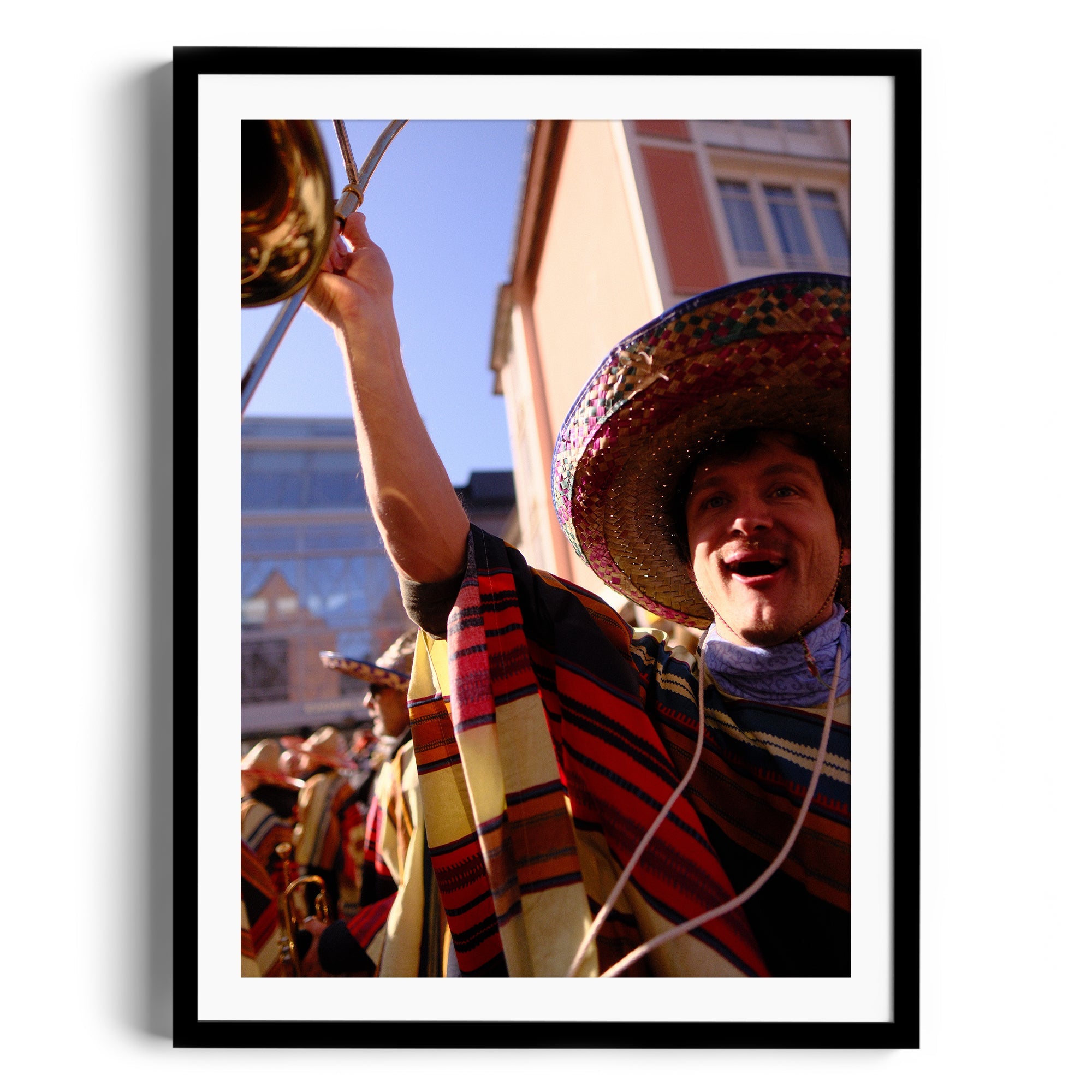 Framed fine art photo of a joyful musician in a sombrero, celebrating mariachi culture at The Dana Gallery in Miami, Florida.