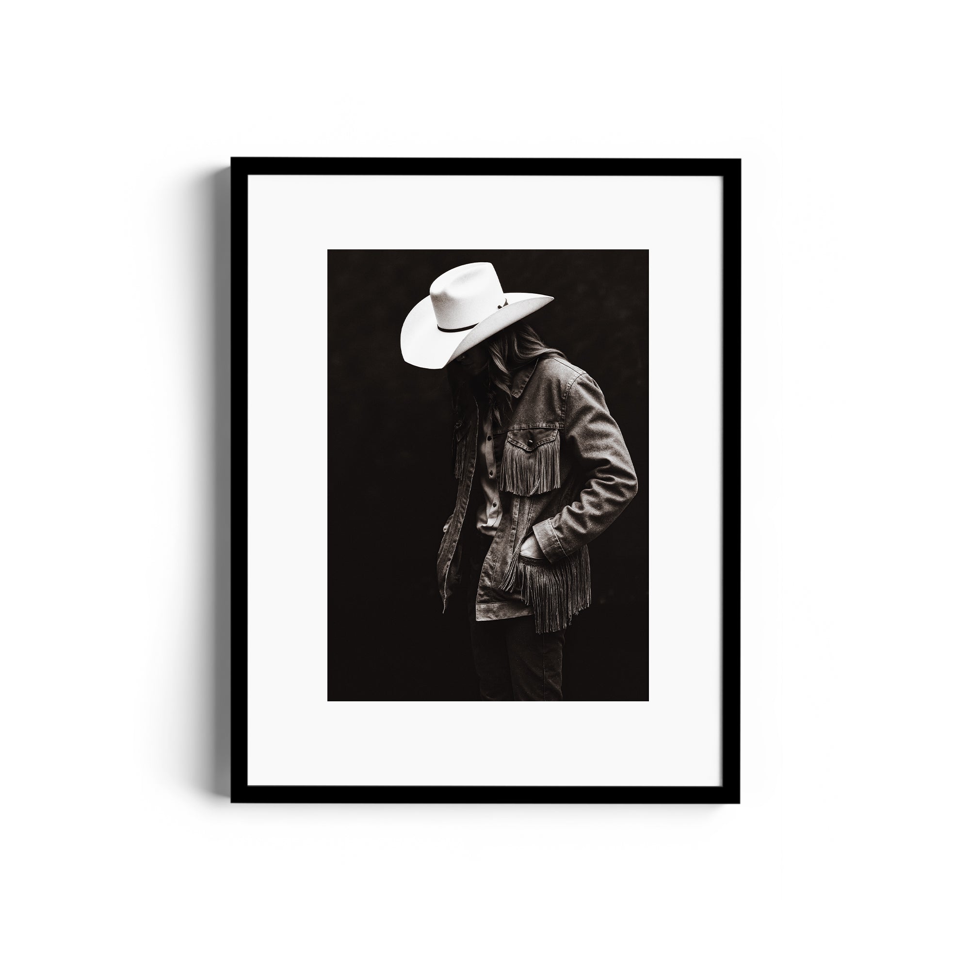 Limited edition fine art print "OUTSITE" by Diego Cadavid, showcasing a figure in a fringed denim jacket and cowboy hat.