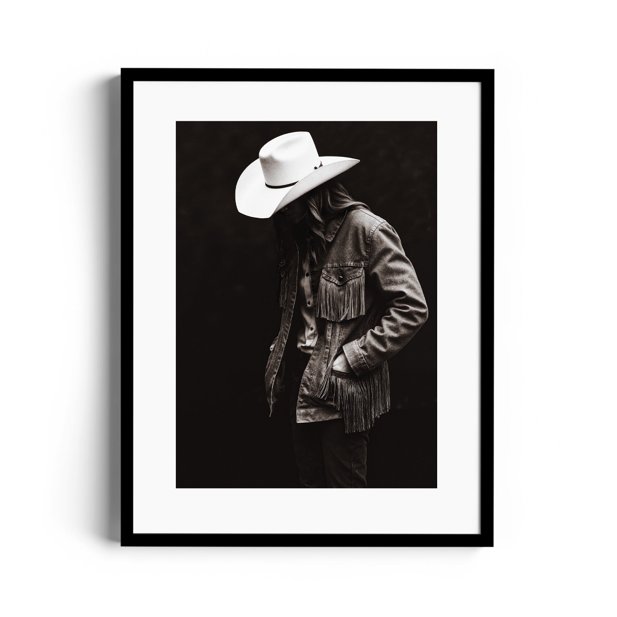 Limited edition fine art print of a lone figure in fringed jacket and cowboy hat, capturing Western spirit in Miami gallery.