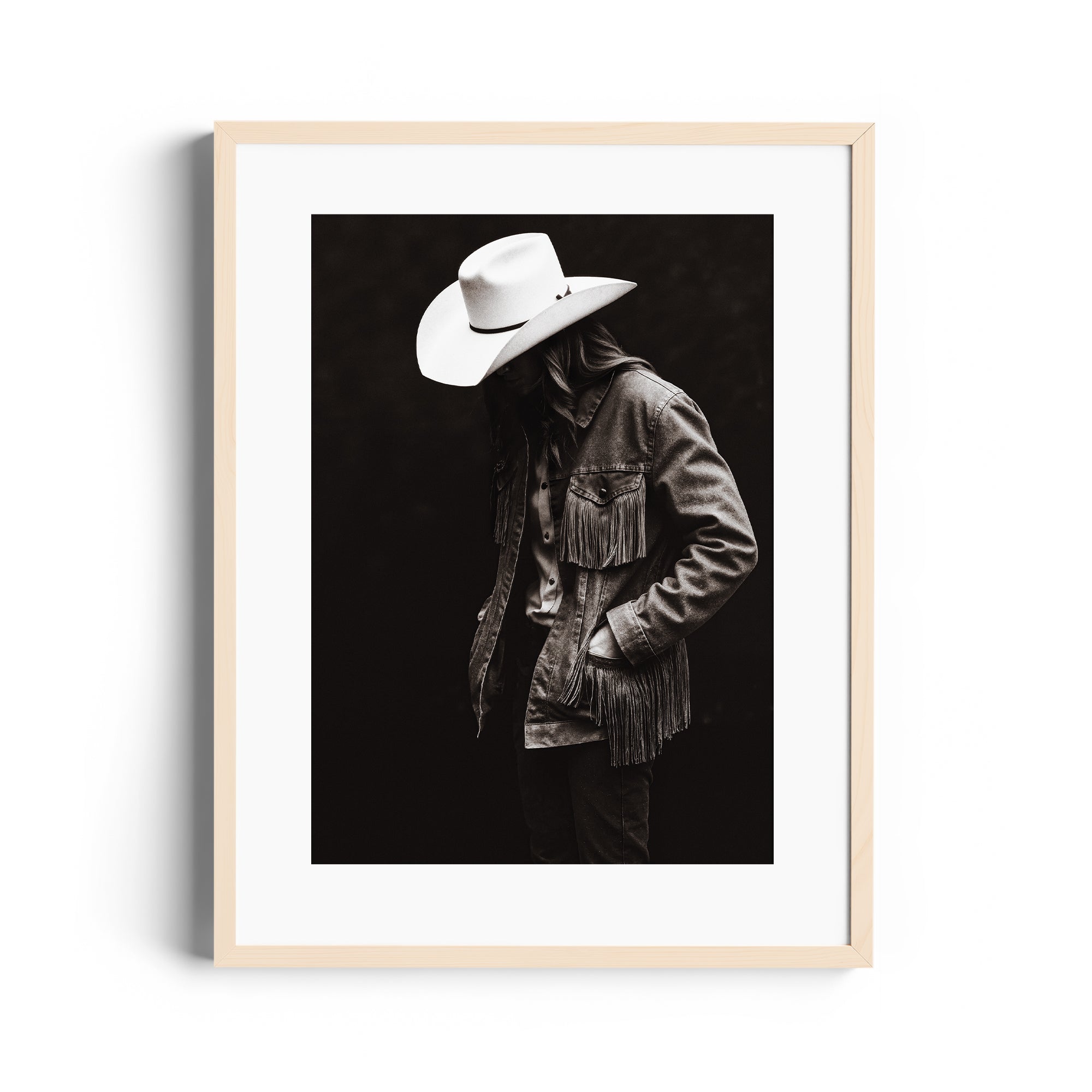 Limited edition fine art photography of a figure in a fringed denim jacket and cowboy hat, captured in Miami.