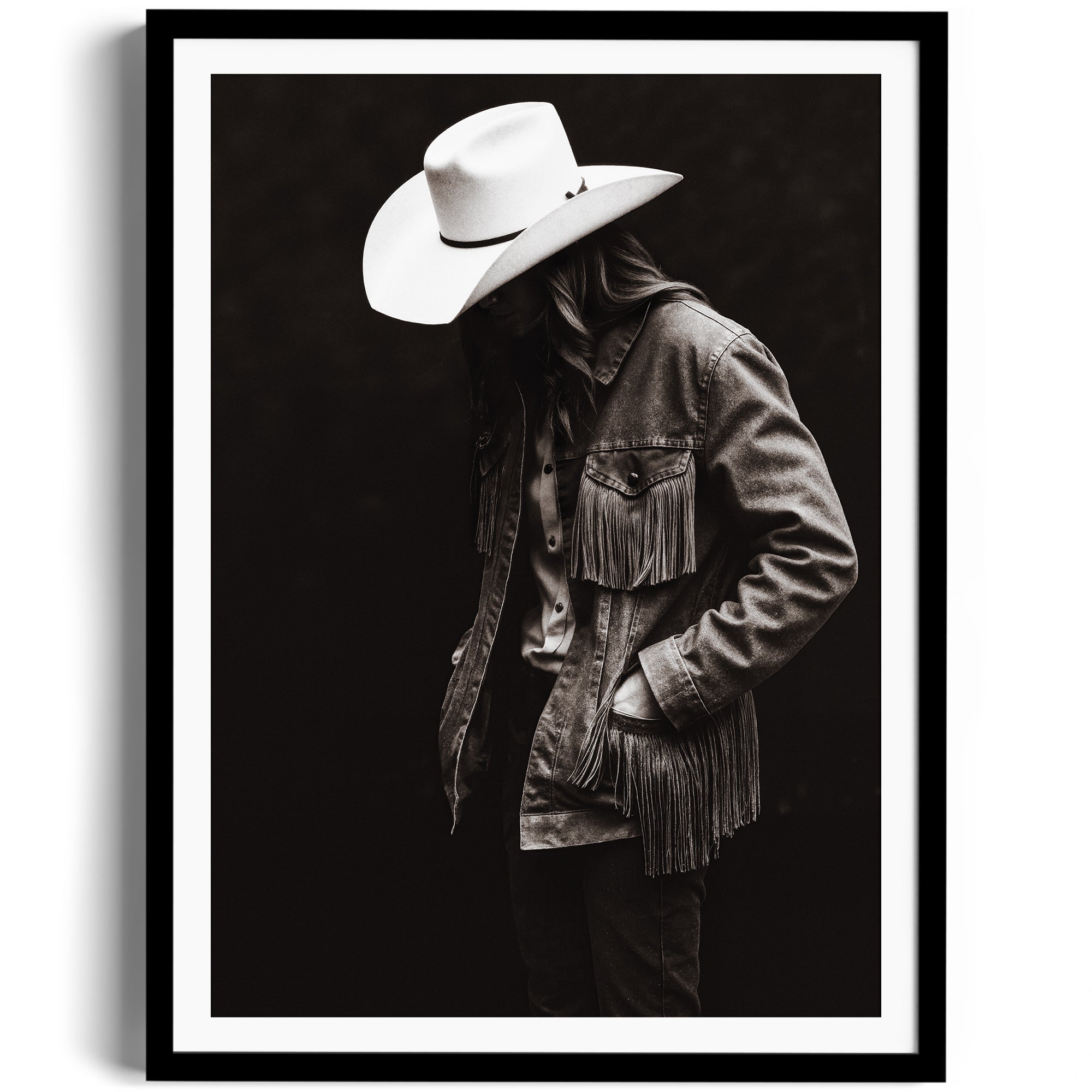 Limited edition fine art photograph of a figure in a fringed denim jacket and cowboy hat, embodying Western spirit.
