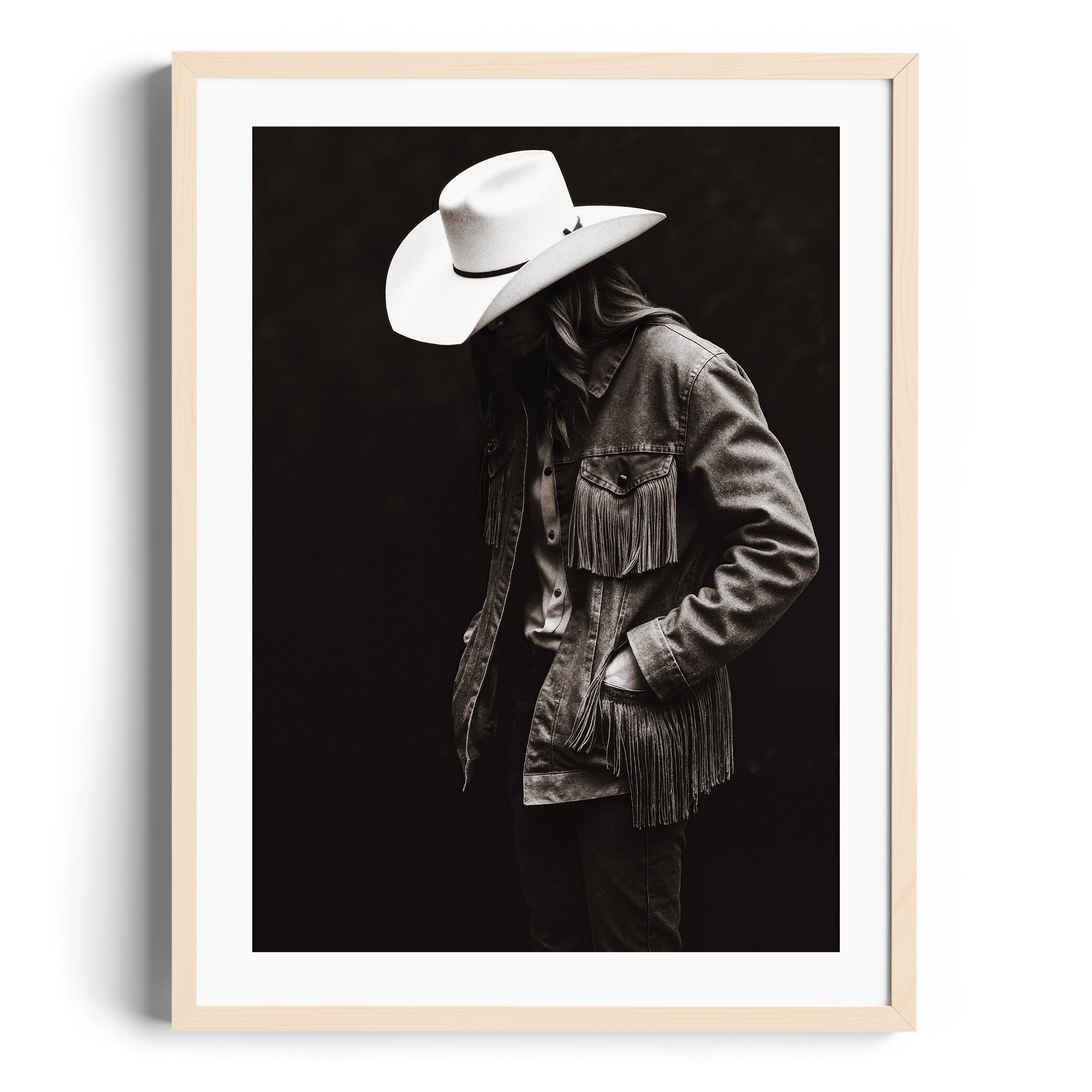 Monochromatic fine art print of a figure in a fringed denim jacket and cowboy hat, representing Western spirit, Miami gallery art.