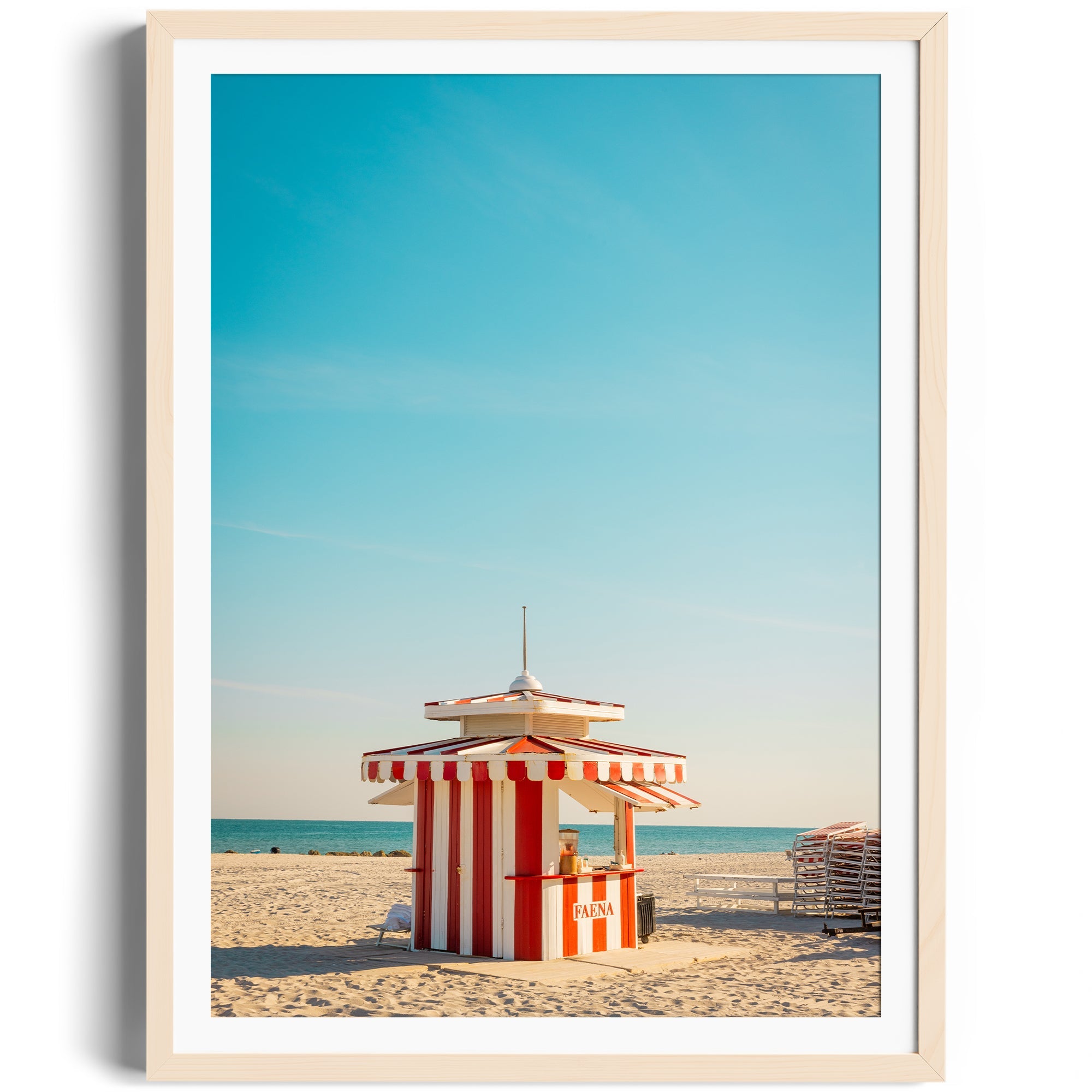 Vibrant red and white beach hut on Miami beach under a clear blue sky, framed fine art photography by George Lozada.