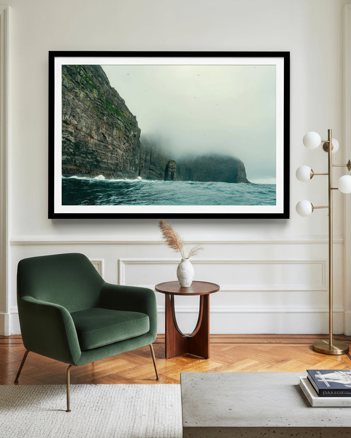 Framed artwork of a coastal scene in a modern living room.
