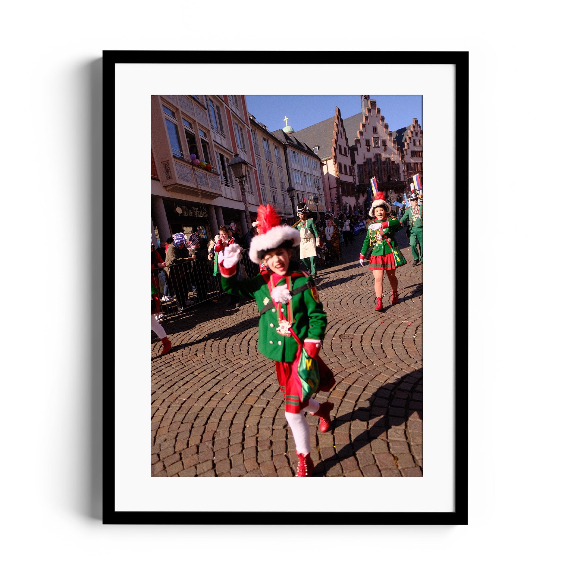 Festive parade with cheerful performers in green outfits and santa hats, embodying holiday spirit.
