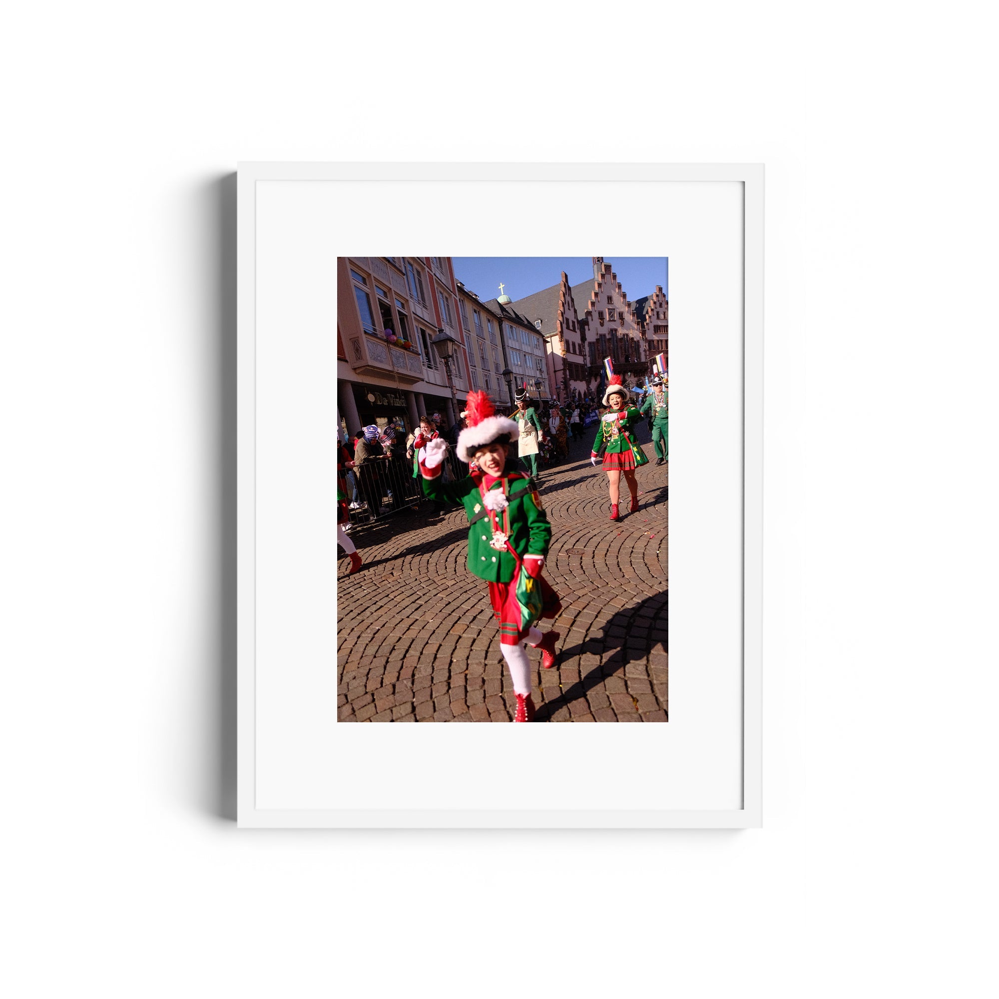 Framed fine art photography of a festive parade with performers in vibrant costumes, captured in a historic European setting.